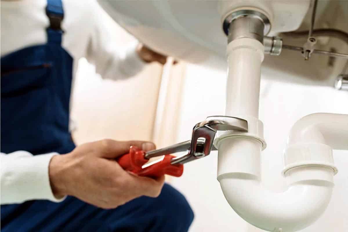 Homeowner avoiding DIY plumbing repair in Redmond WA due to risks