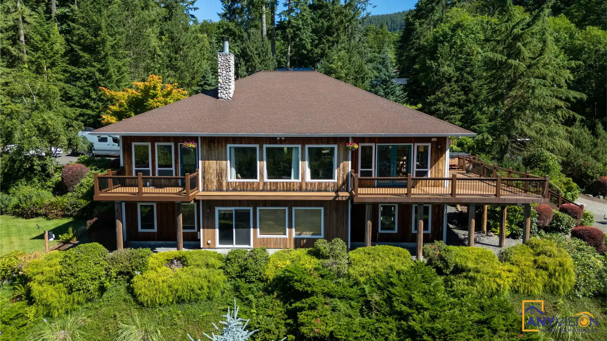 Elevated view of the deck wrapping the upper level of the house