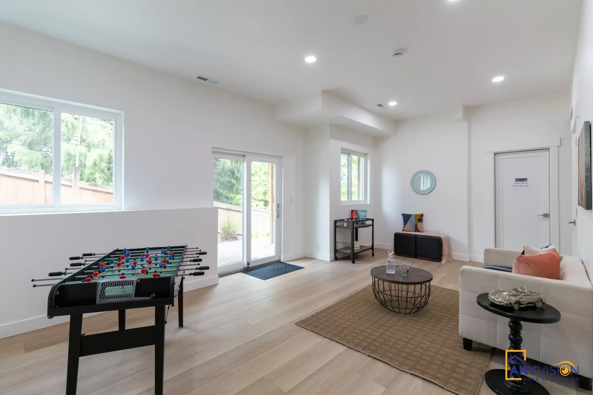 Lower-level bonus room set up for games and seating