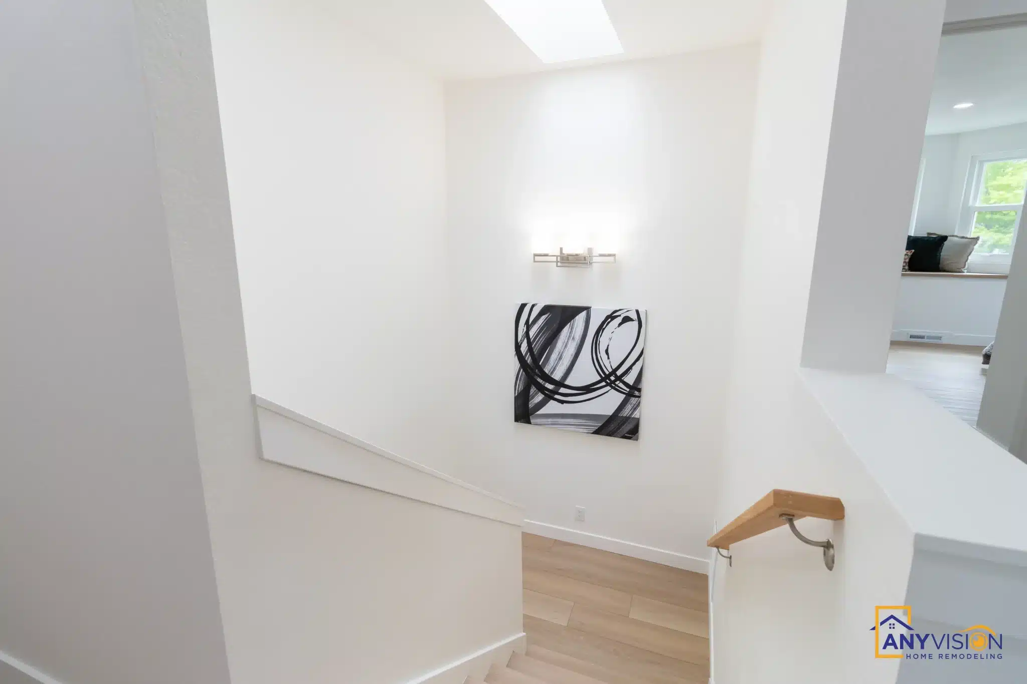 Stair landing with skylight and clean plaster returns