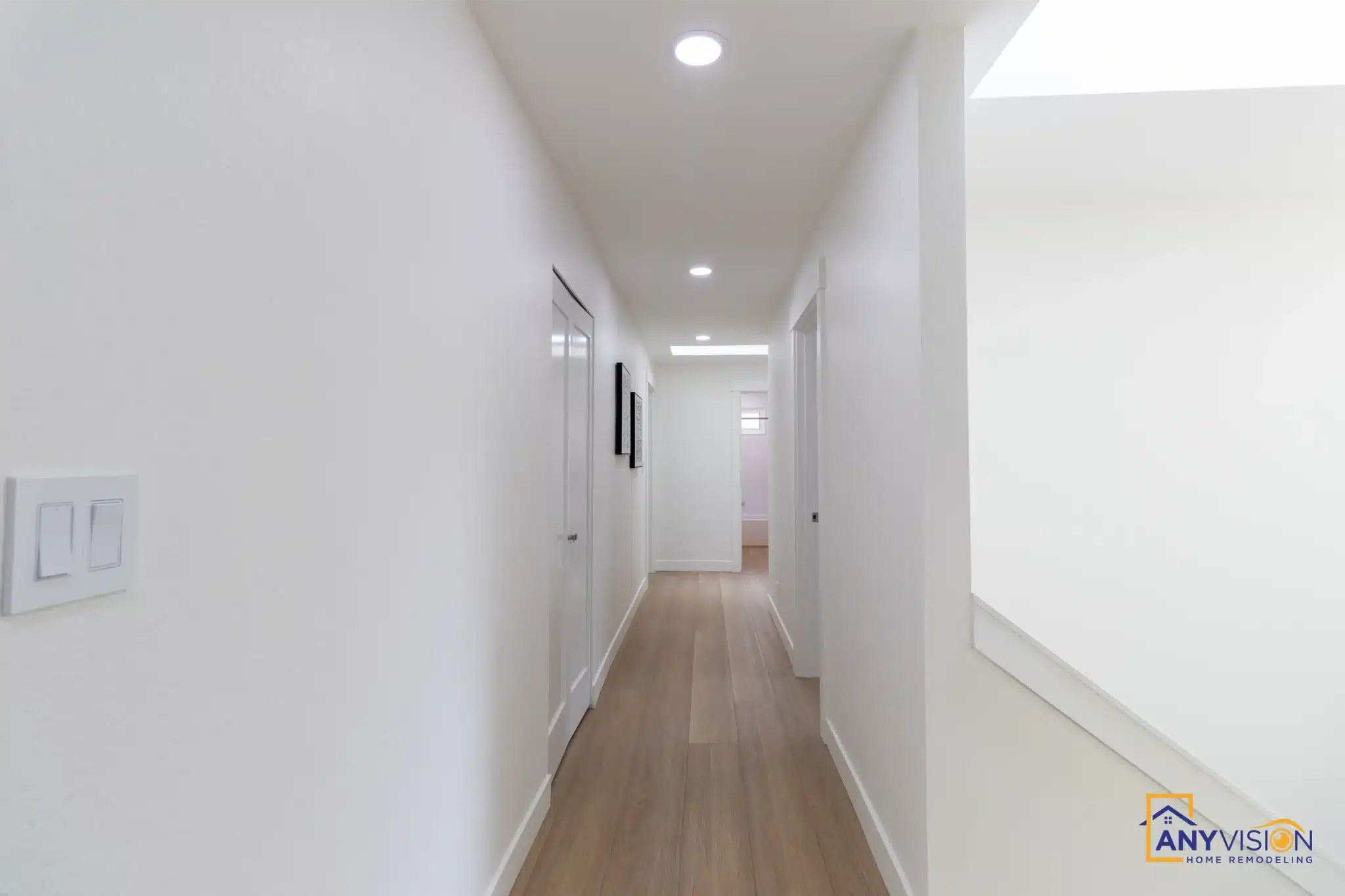 Upstairs hallway with plank flooring running through