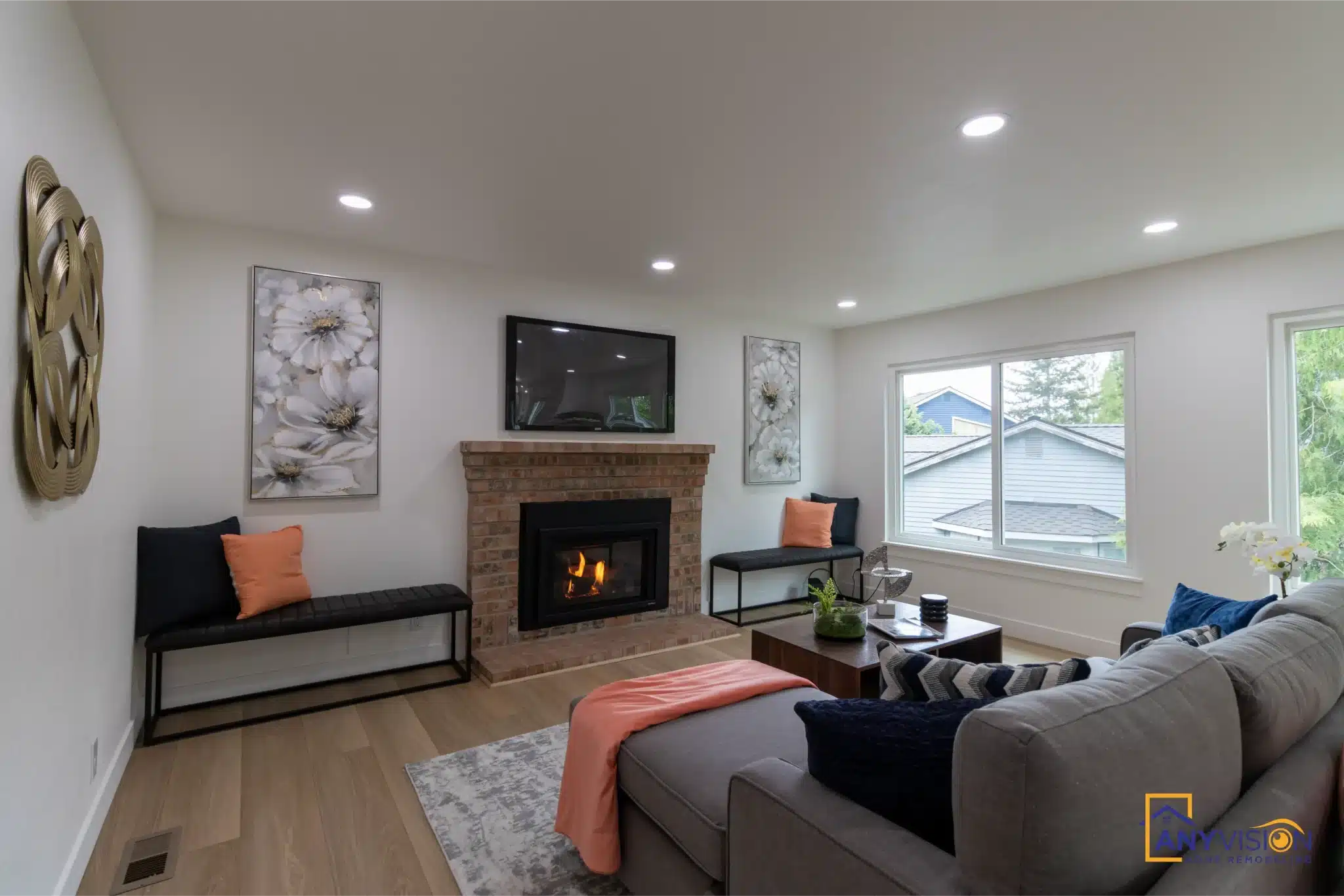Living room with fireplace and open sightlines after a whole-home remodel