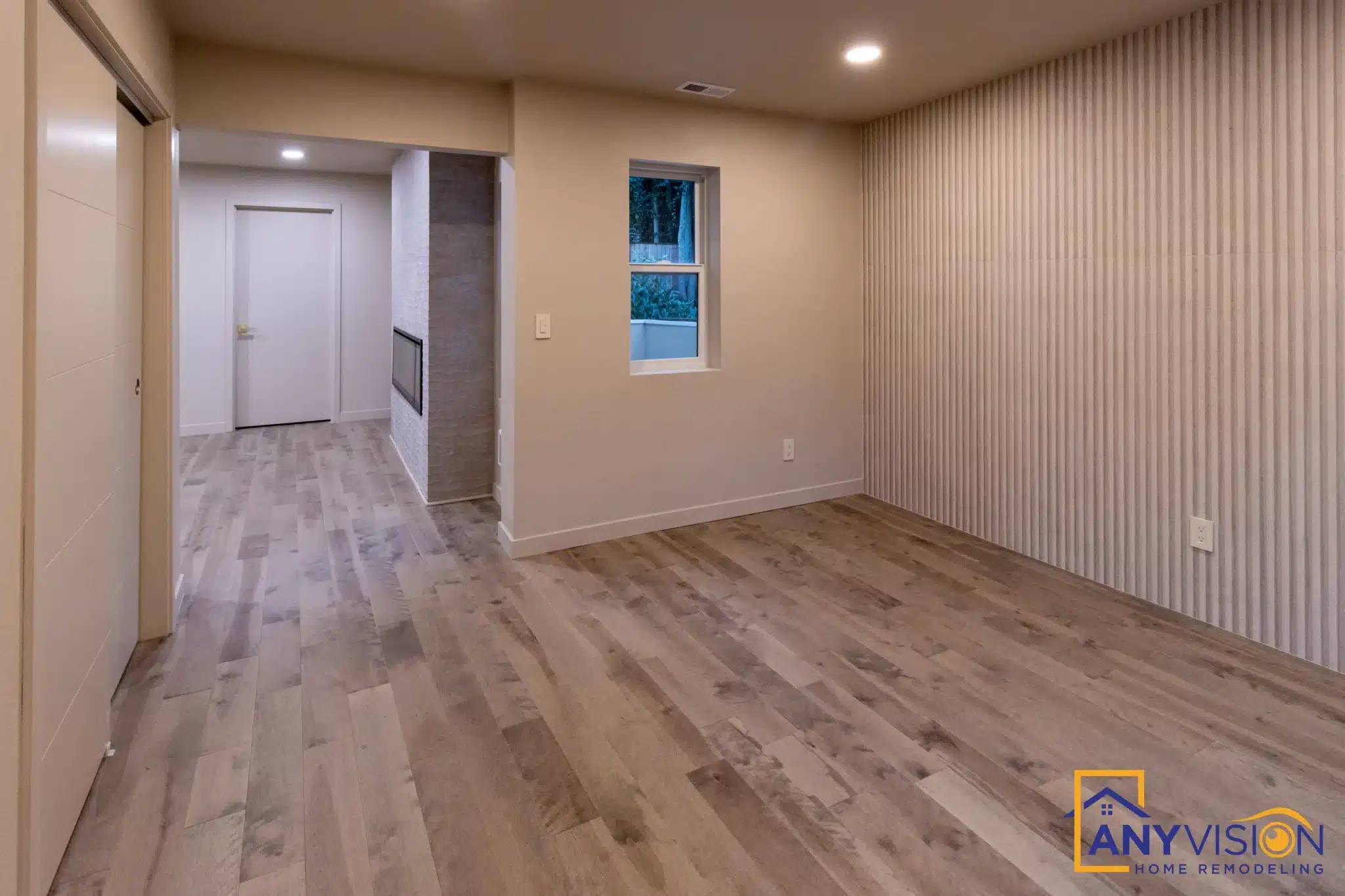 Bedroom in a completed Anyvision suite addition with a fluted feature wall