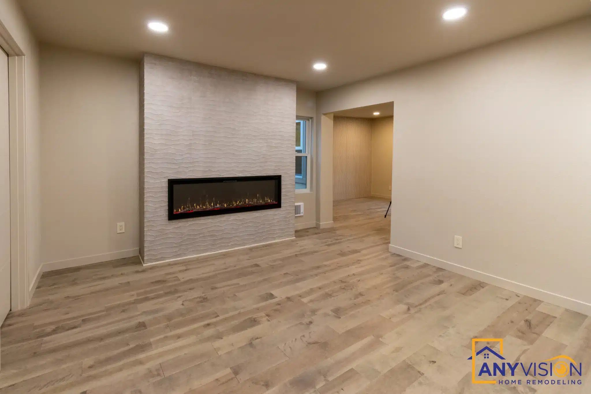 Primary suite addition with a linear fireplace completed by Anyvision
