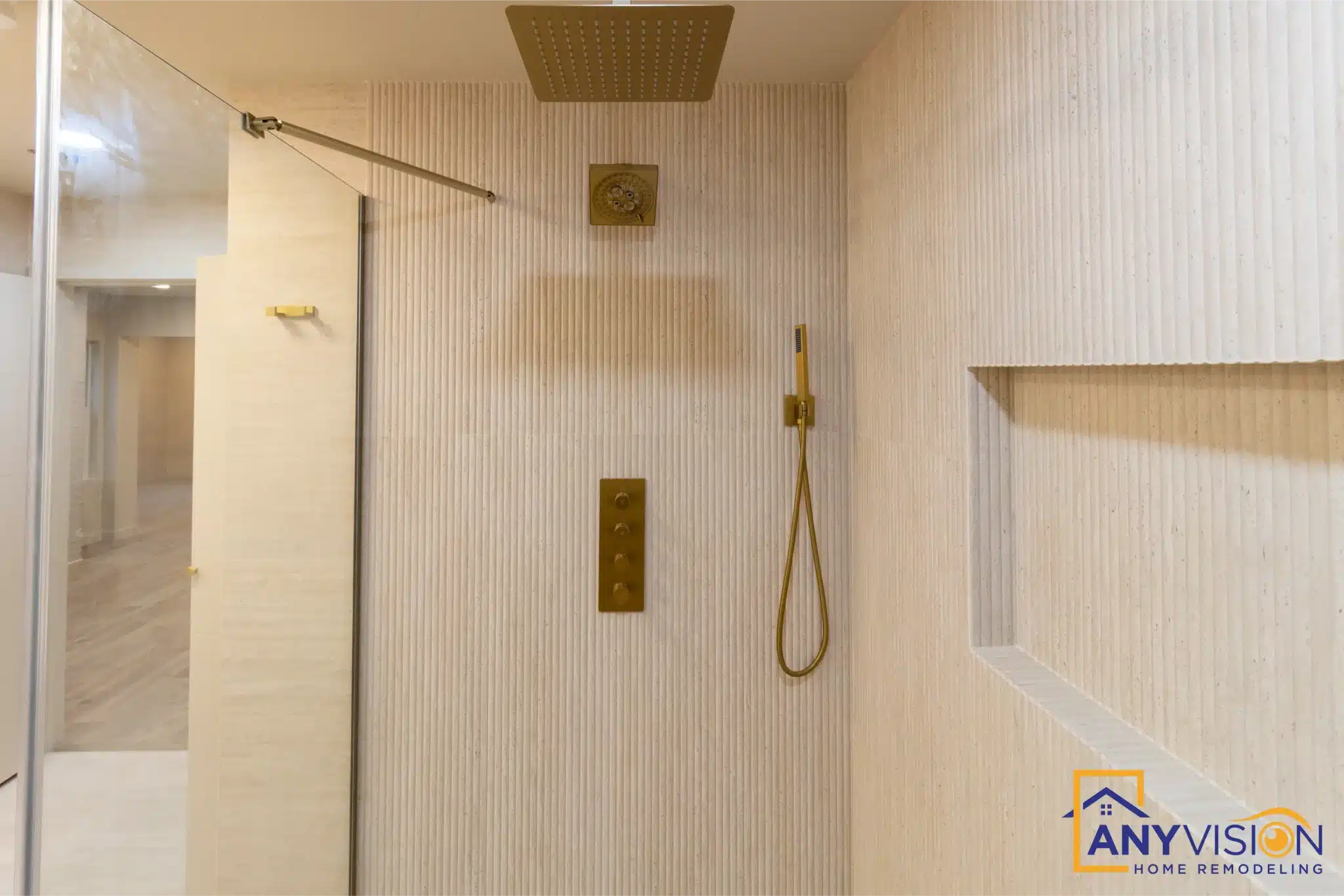 Rainfall head and niche detail in brushed gold