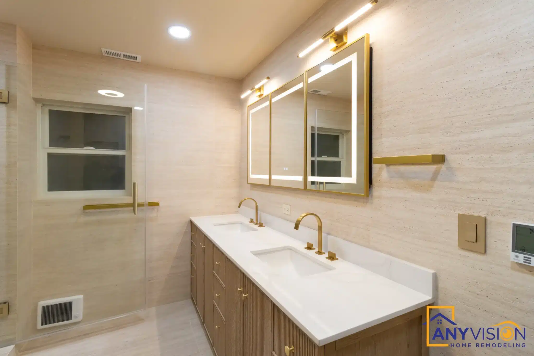 Ensuite vanity run with window and backlit mirrors