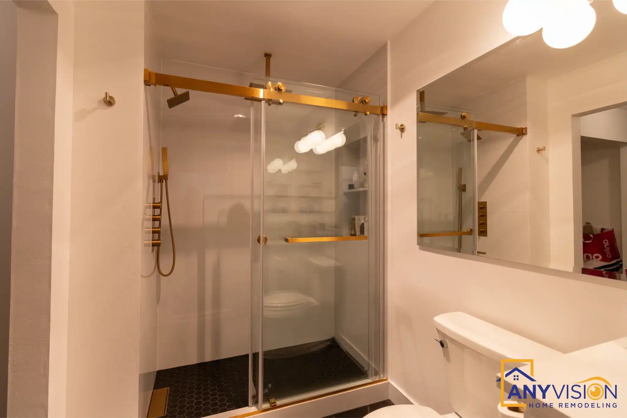 Compact bathroom with a glass shower enclosure completed by Anyvision