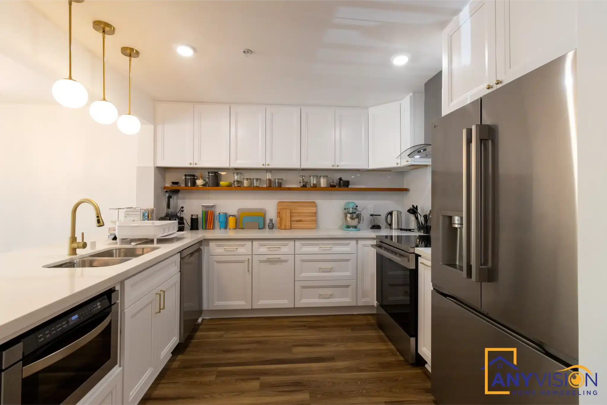 Compact kitchen with brass pendants and open shelving
