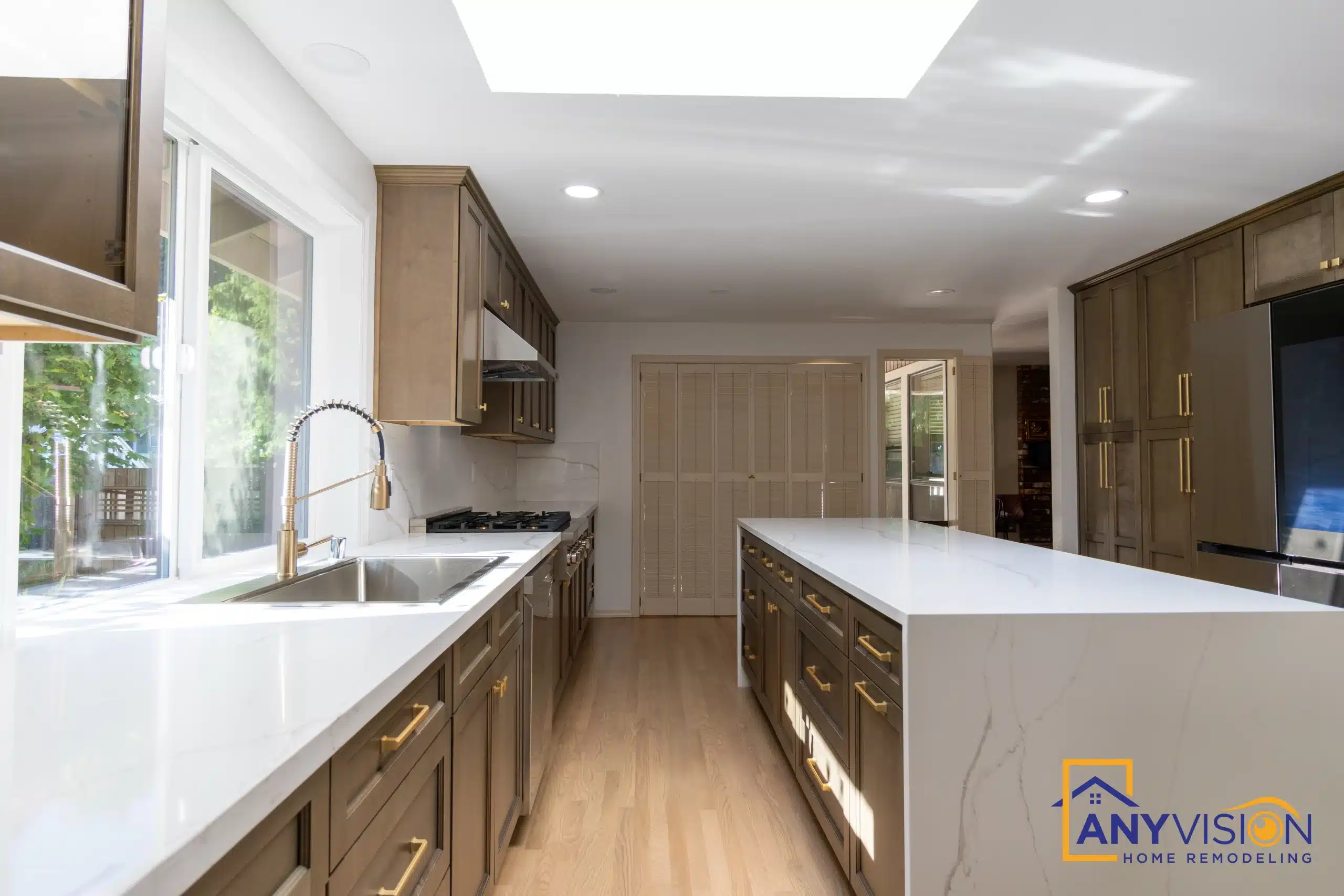 Sink run beneath the window with the island alongside