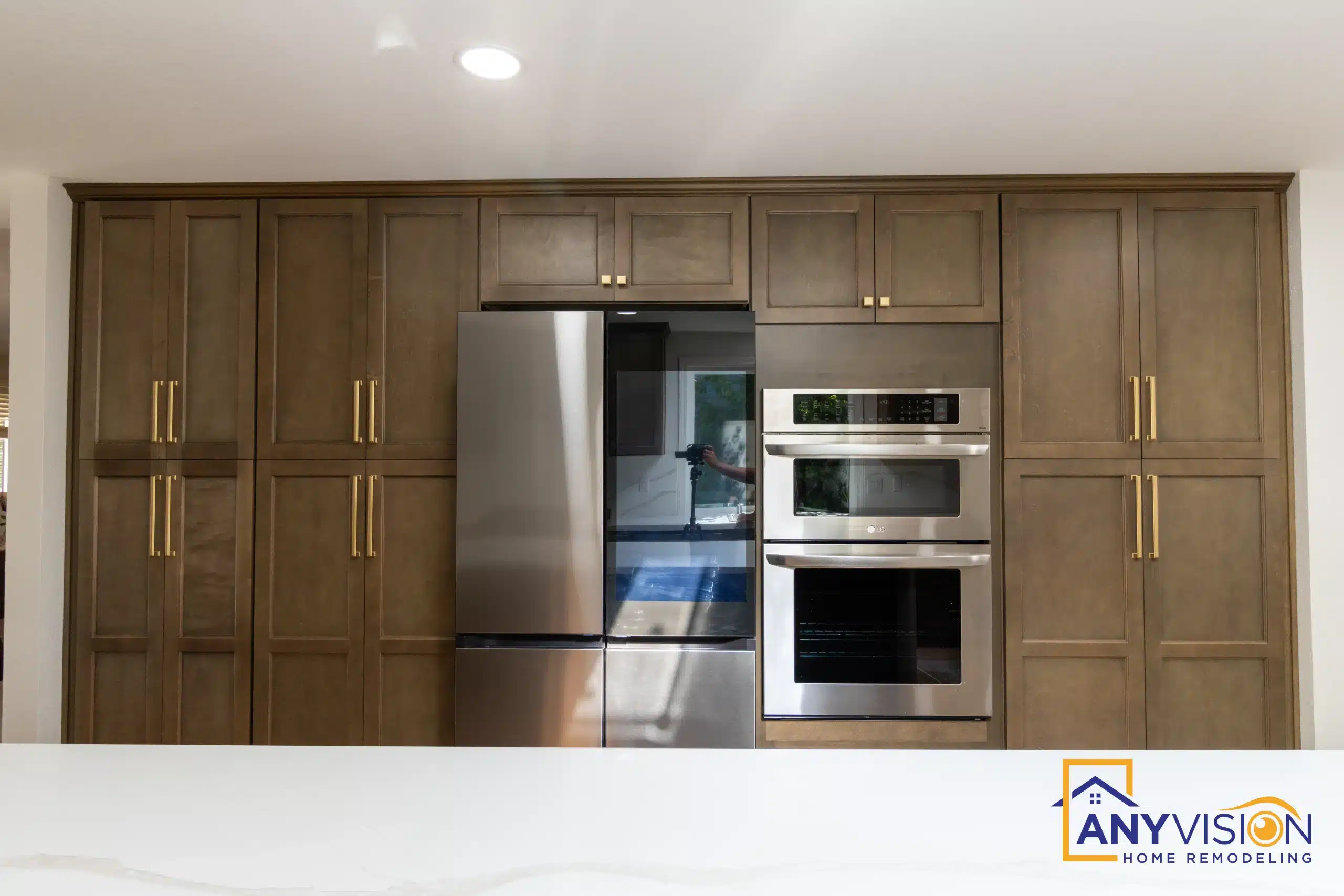 Stainless double wall ovens integrated into full-height cabinetry