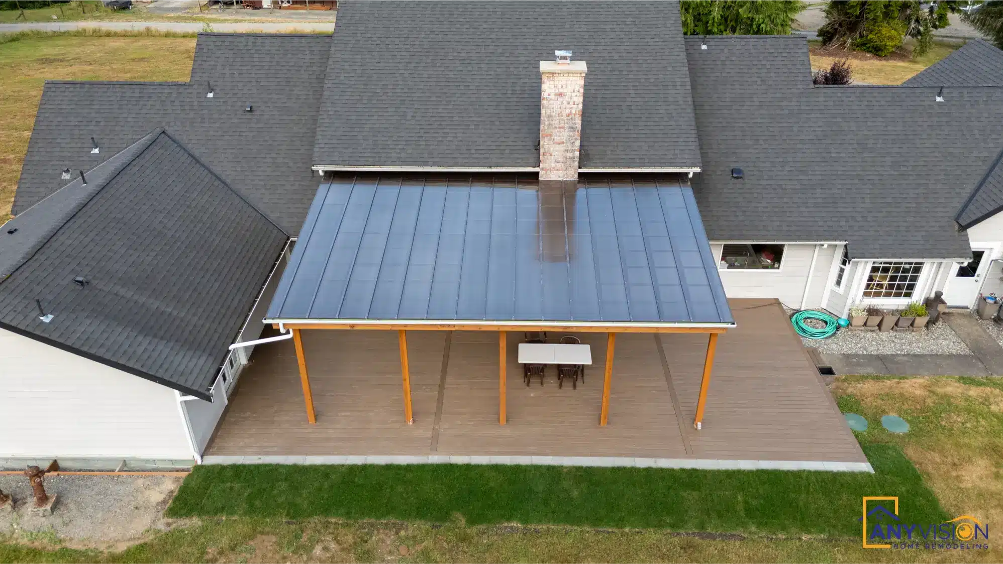 Standing-seam roof panels running to the eave