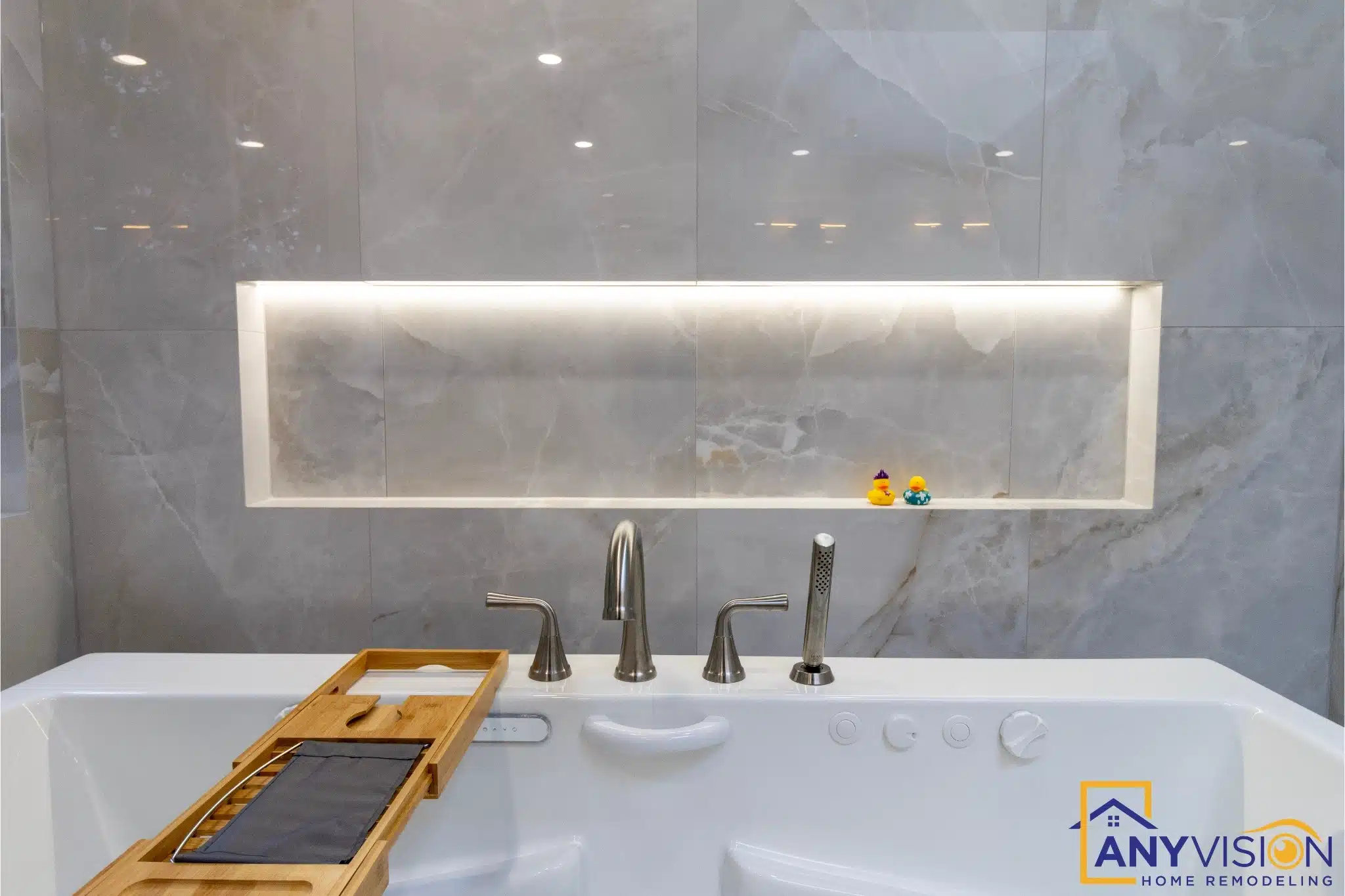 Backlit niche and stone surround above the vanity run
