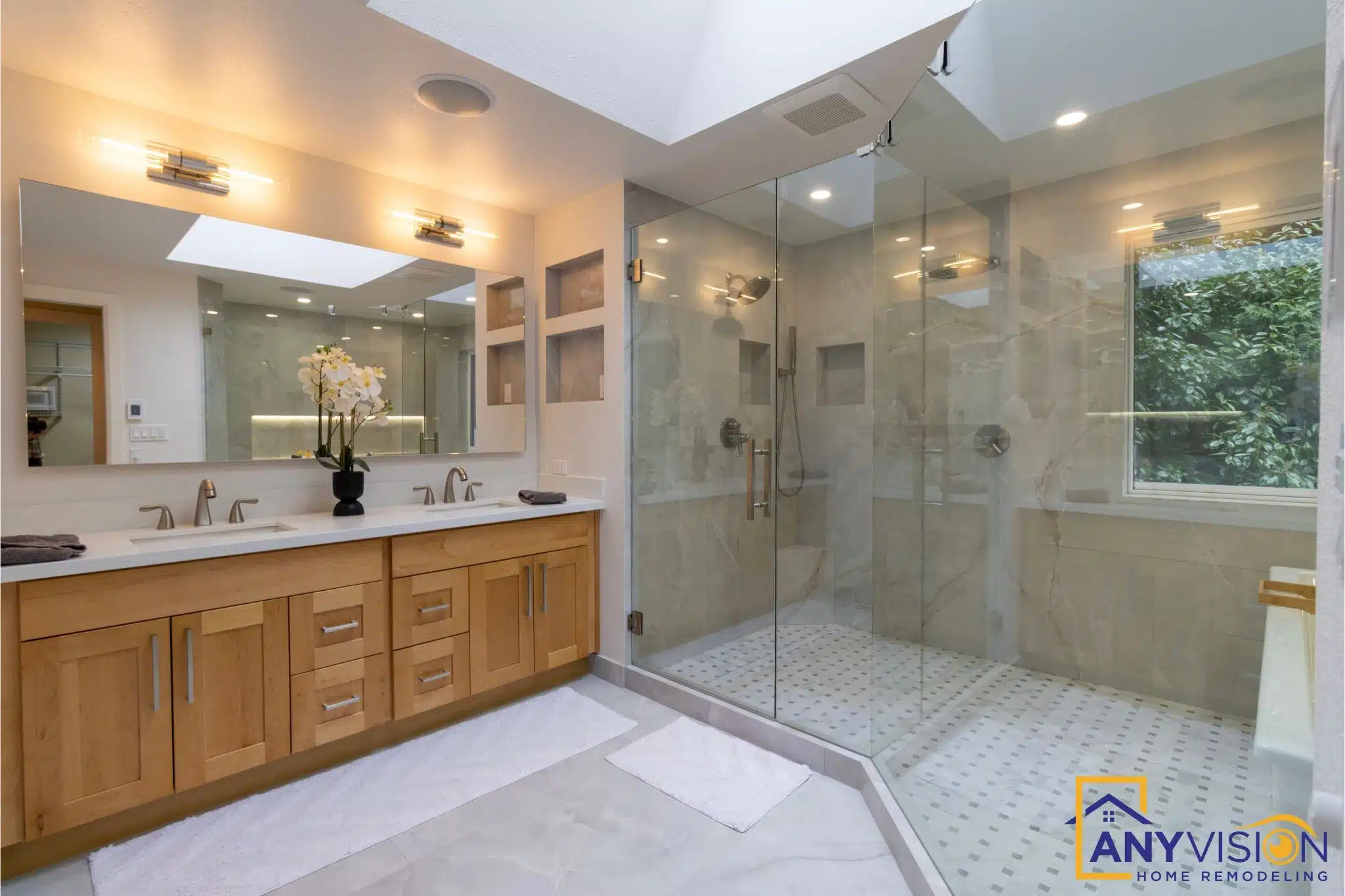 Master bathroom with a walk-in glass shower and stone-topped vanity