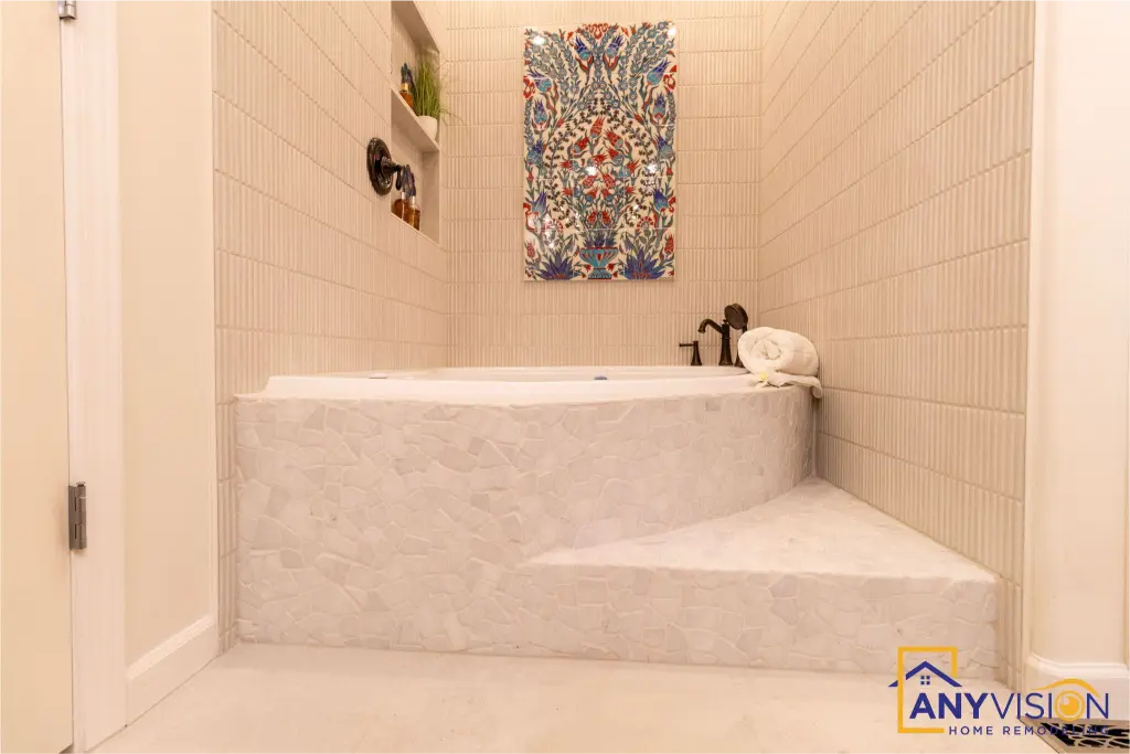 Tiled tub surround with the decorative panel above