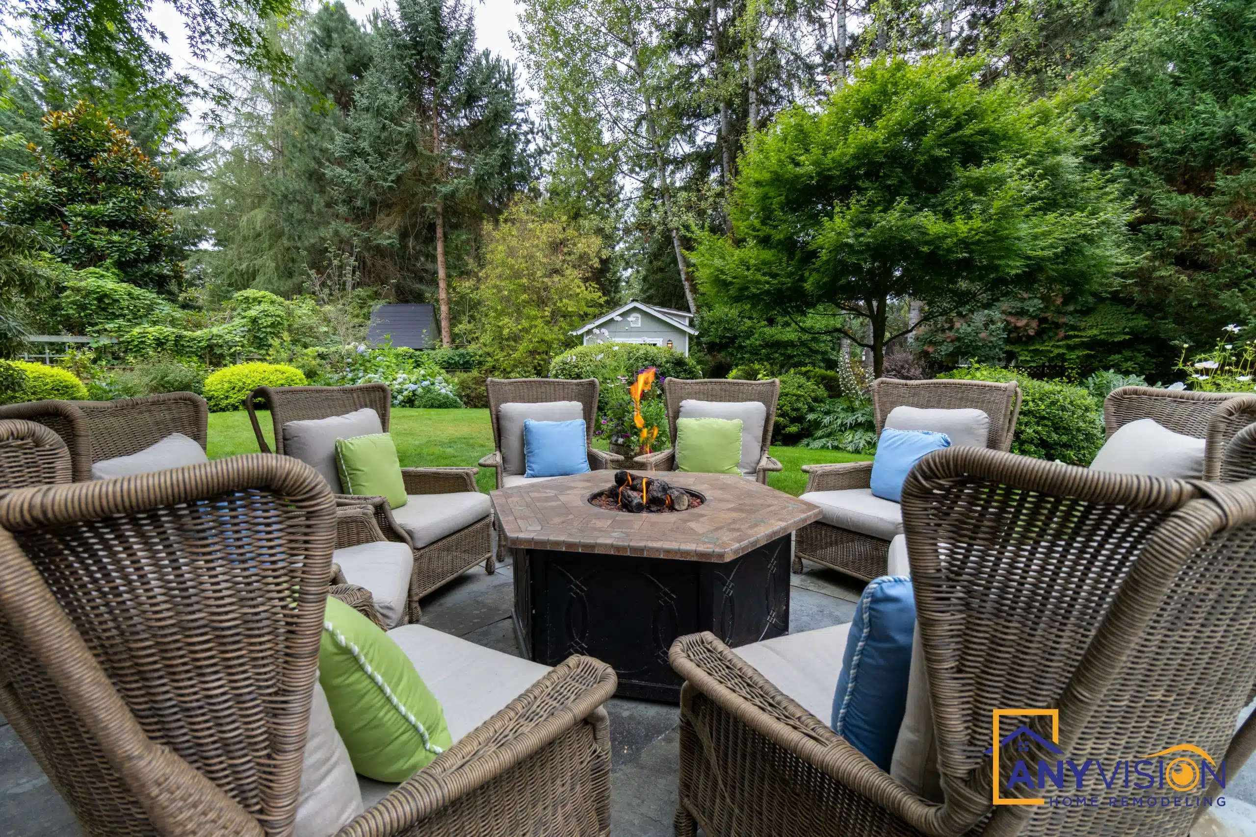 Fire-pit table surrounded by cushioned outdoor seating