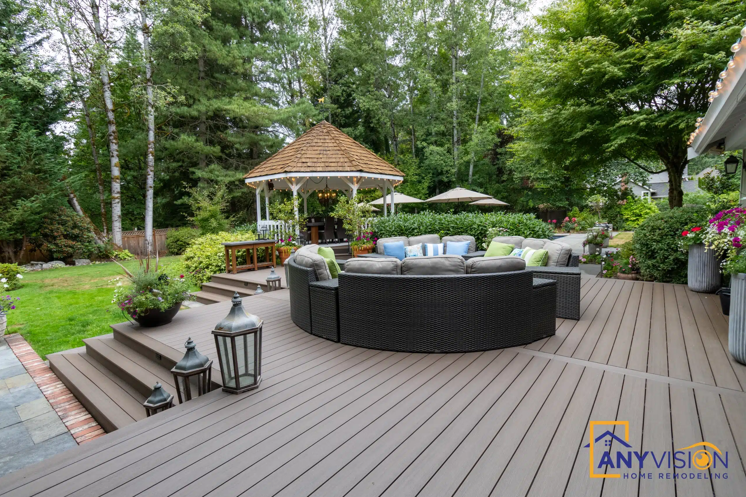 Lounge terrace with the gazebo behind and planting along the edge