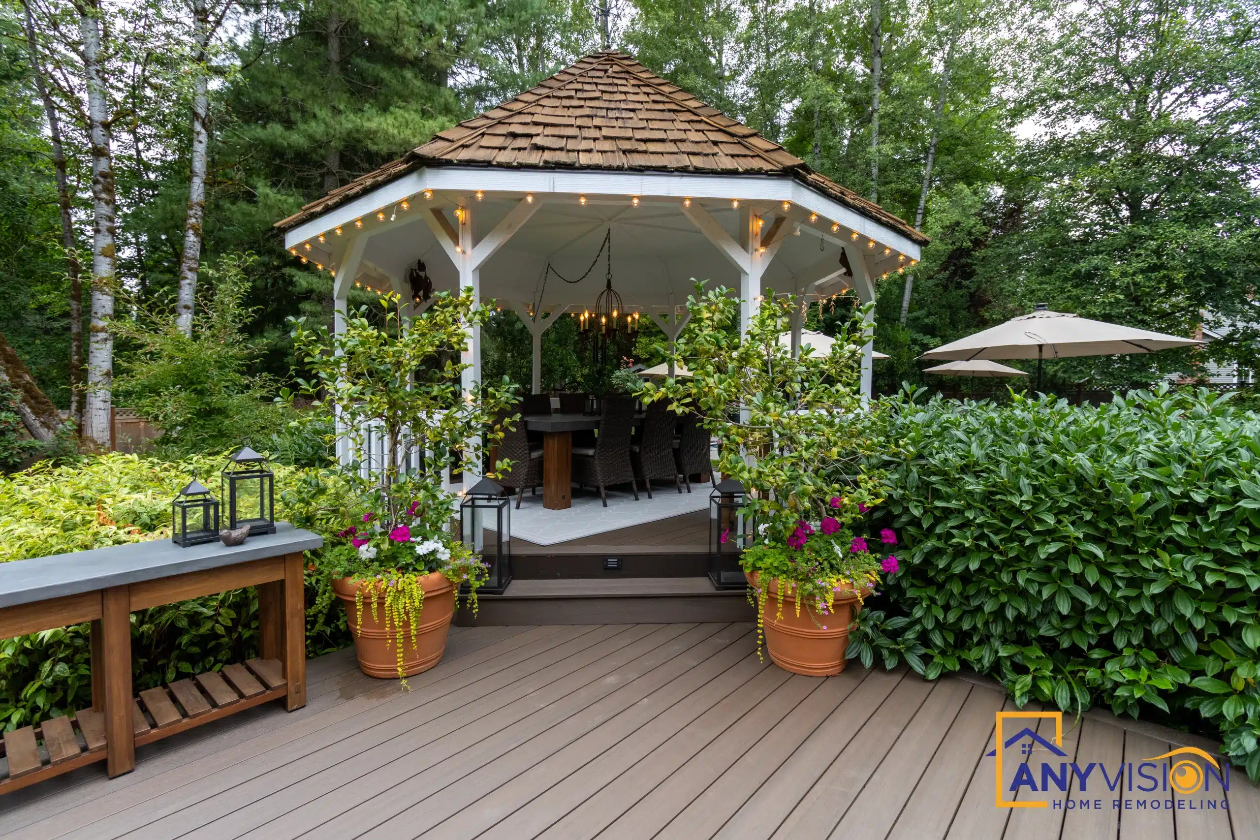 Interior of the shingled gazebo with planters and seating