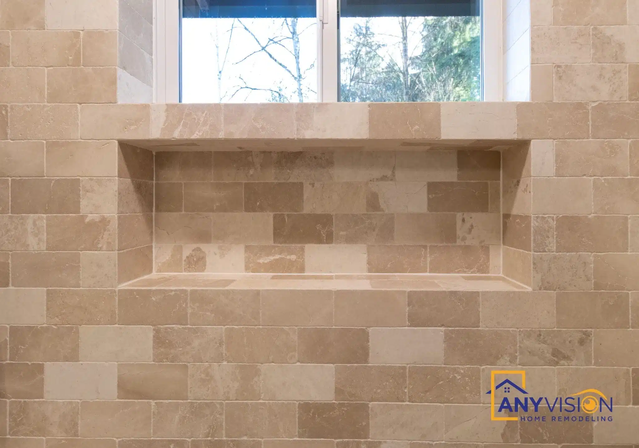 Tiled shower niche with a shelf beneath the window