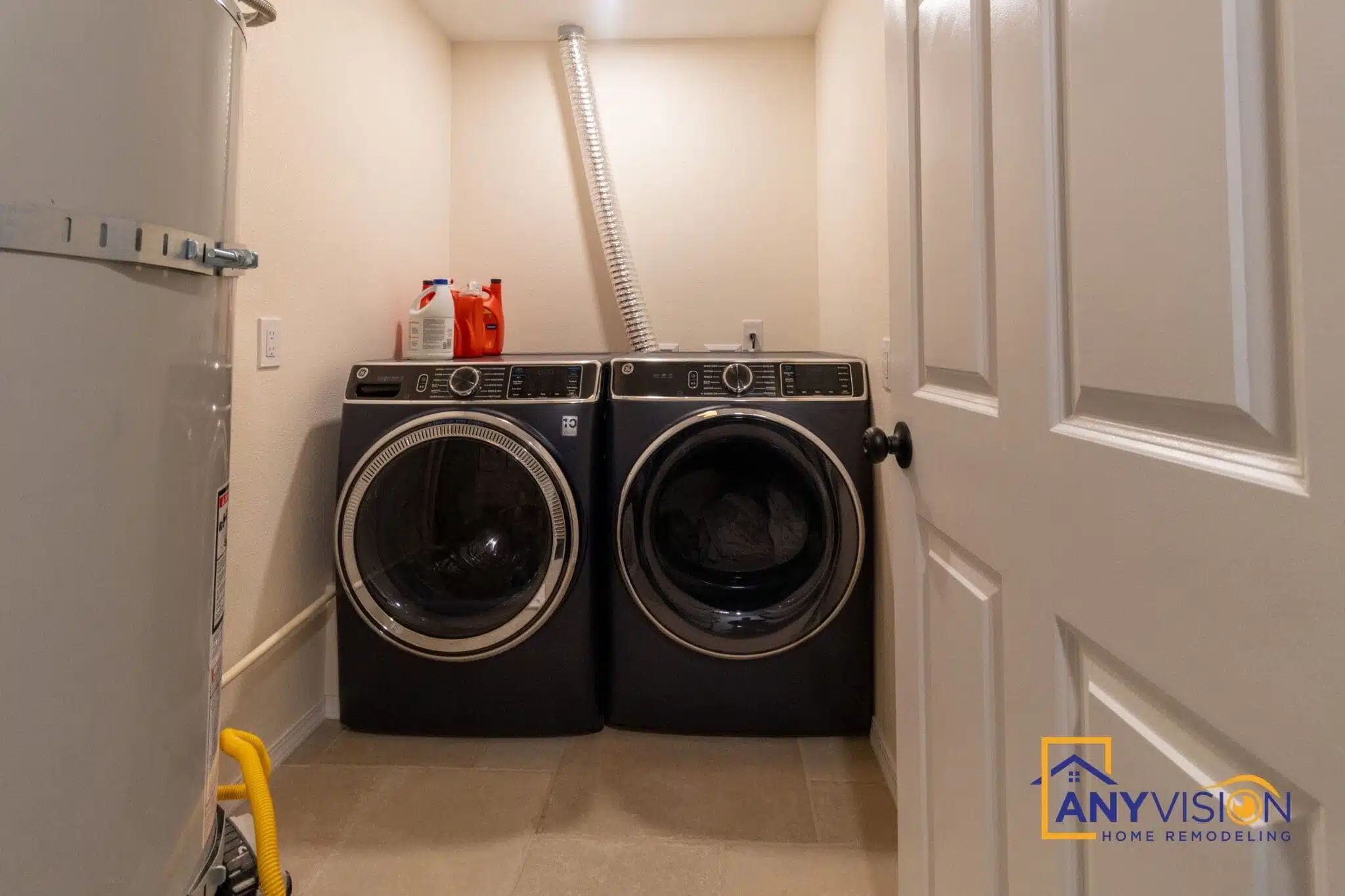 Dedicated laundry room with side-by-side washer and dryer