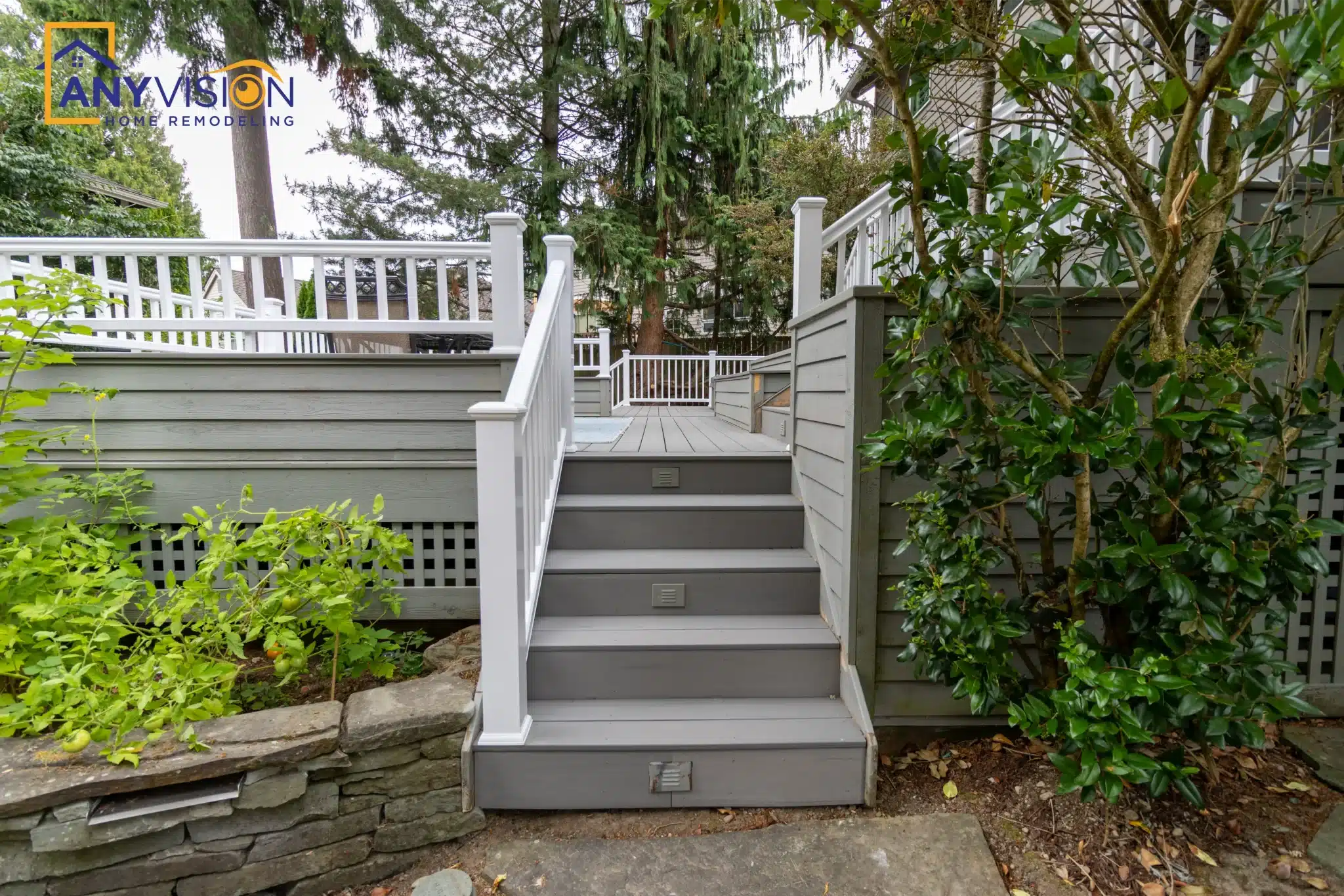 Wide stair run with white railings descending to the garden