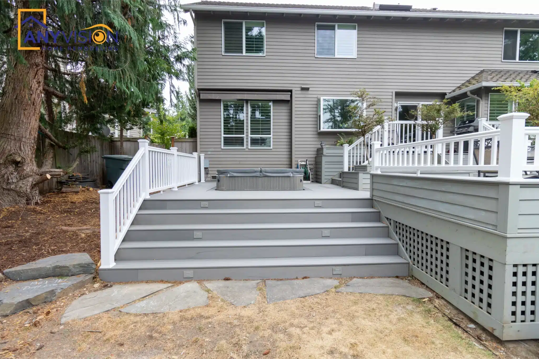 Rear elevation of the house showing the deck and its full-width stair run