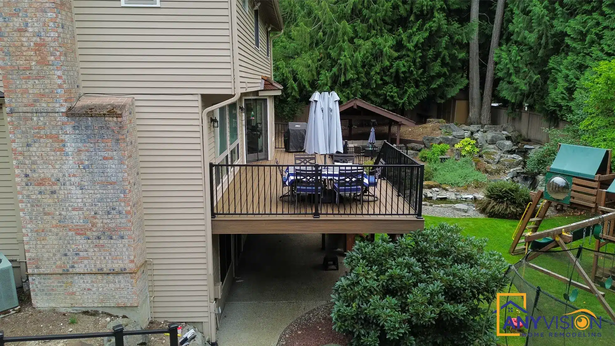 Deck and garden seen together, showing the established planting around the structures