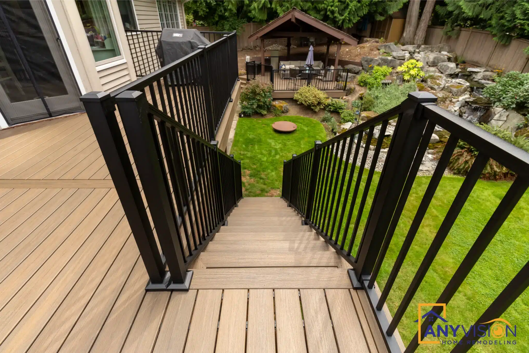 Stair run descending from the upper deck with black metal railings