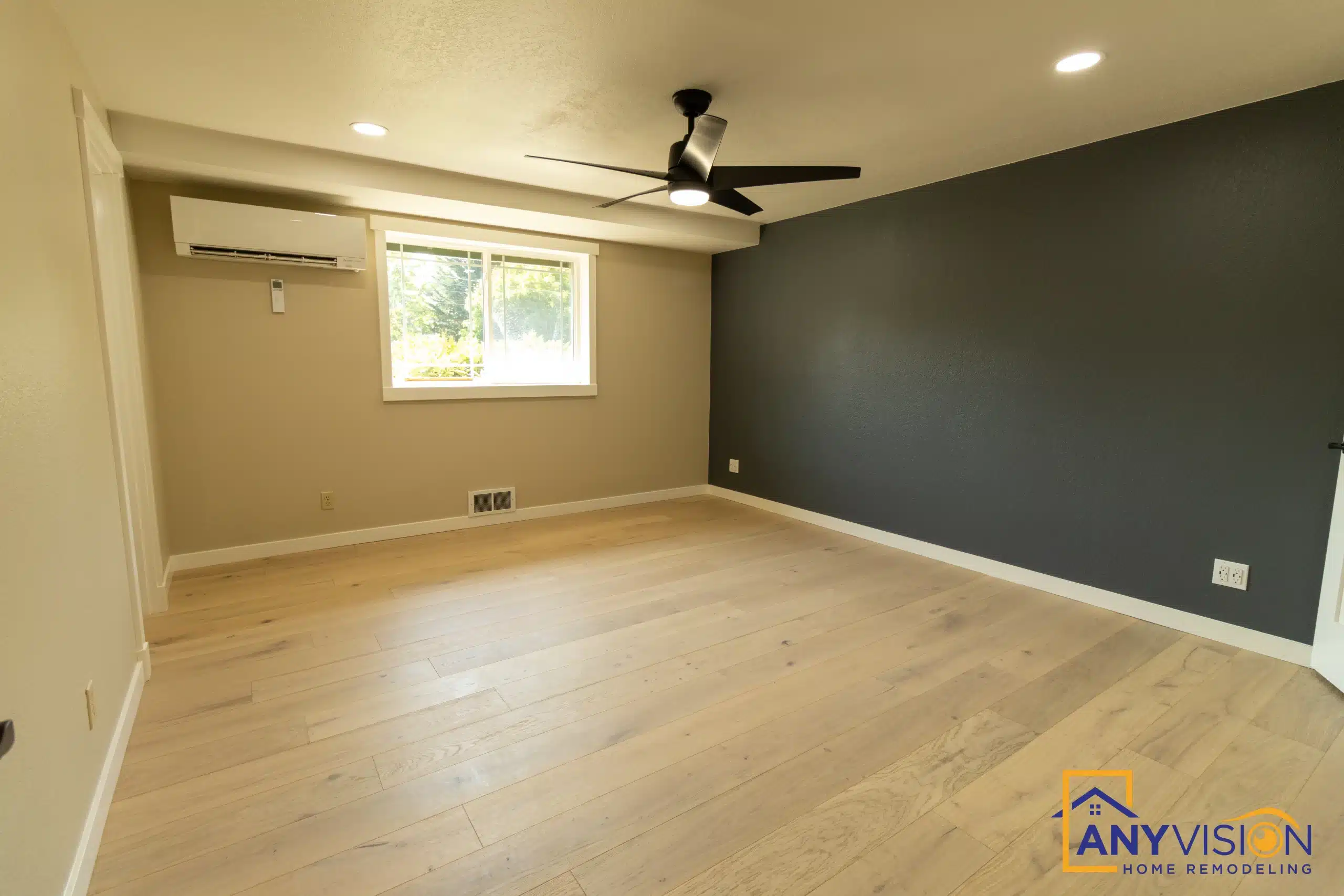 Bedroom with a ceiling fan and refinished flooring
