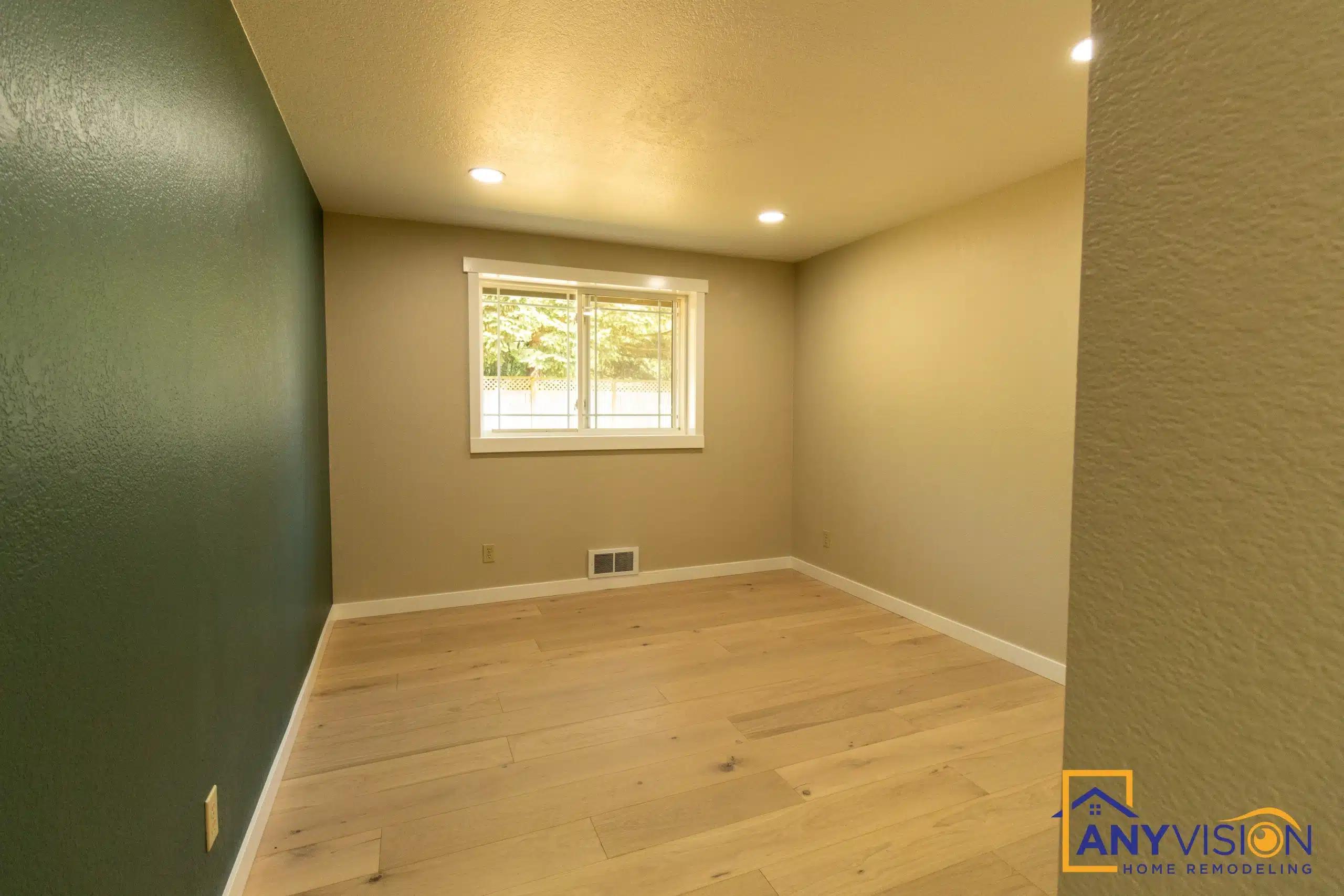 Bedroom finished with new flooring and window