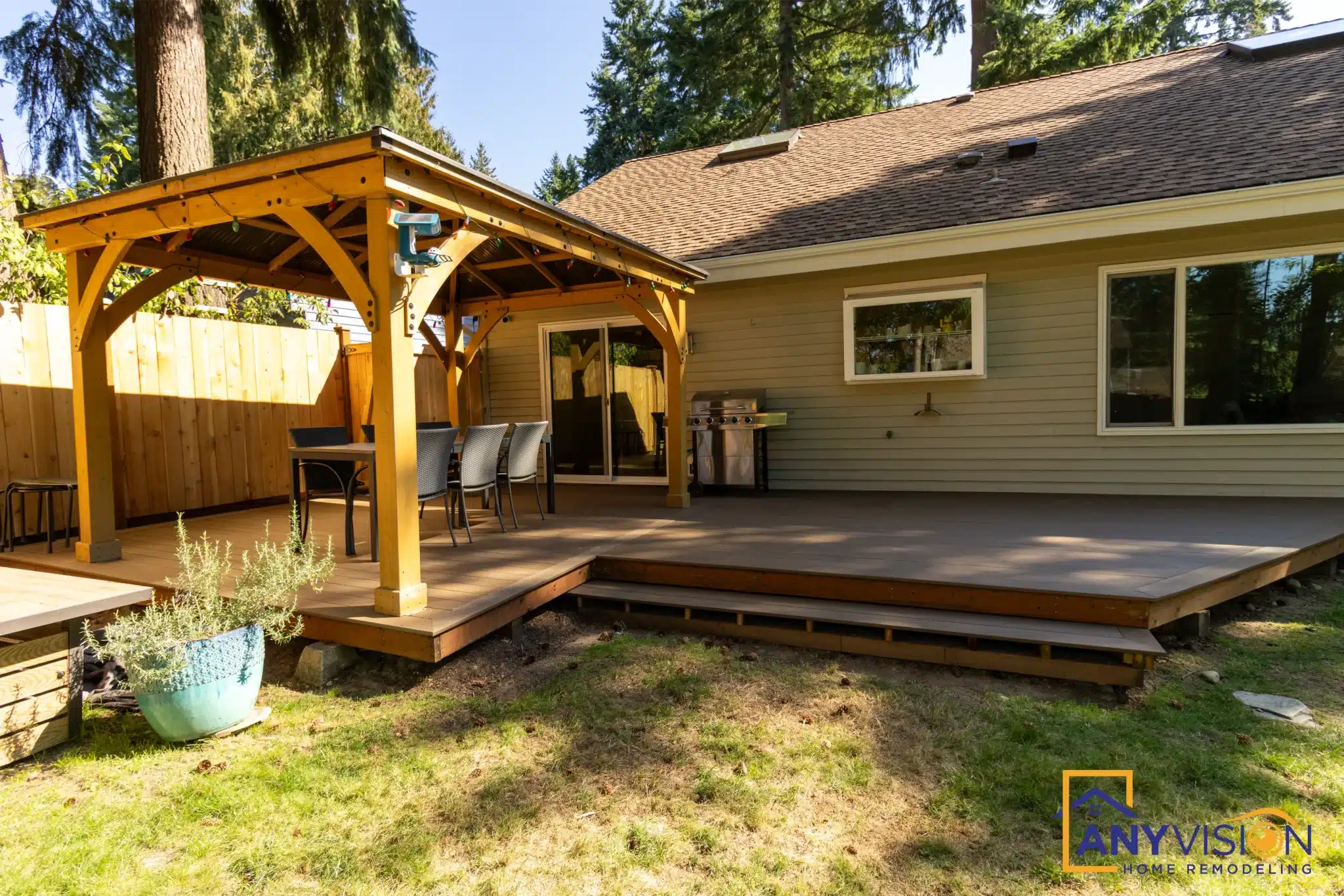 Rear elevation with the cedar pergola and deck running the width of the house