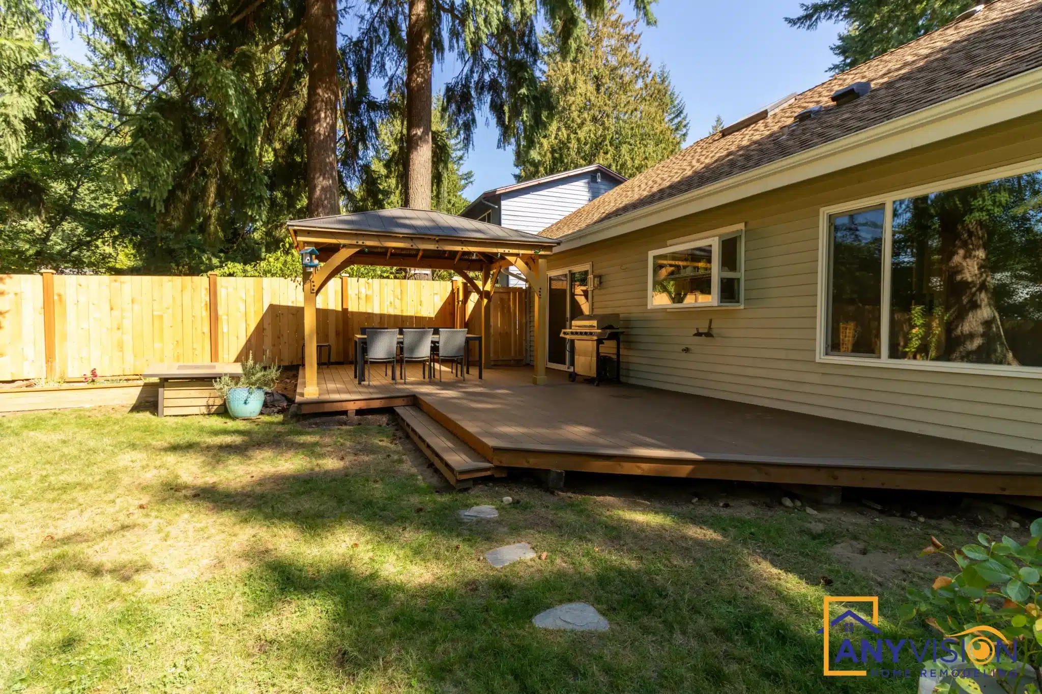 Deck and pergola seen from the far corner of the garden