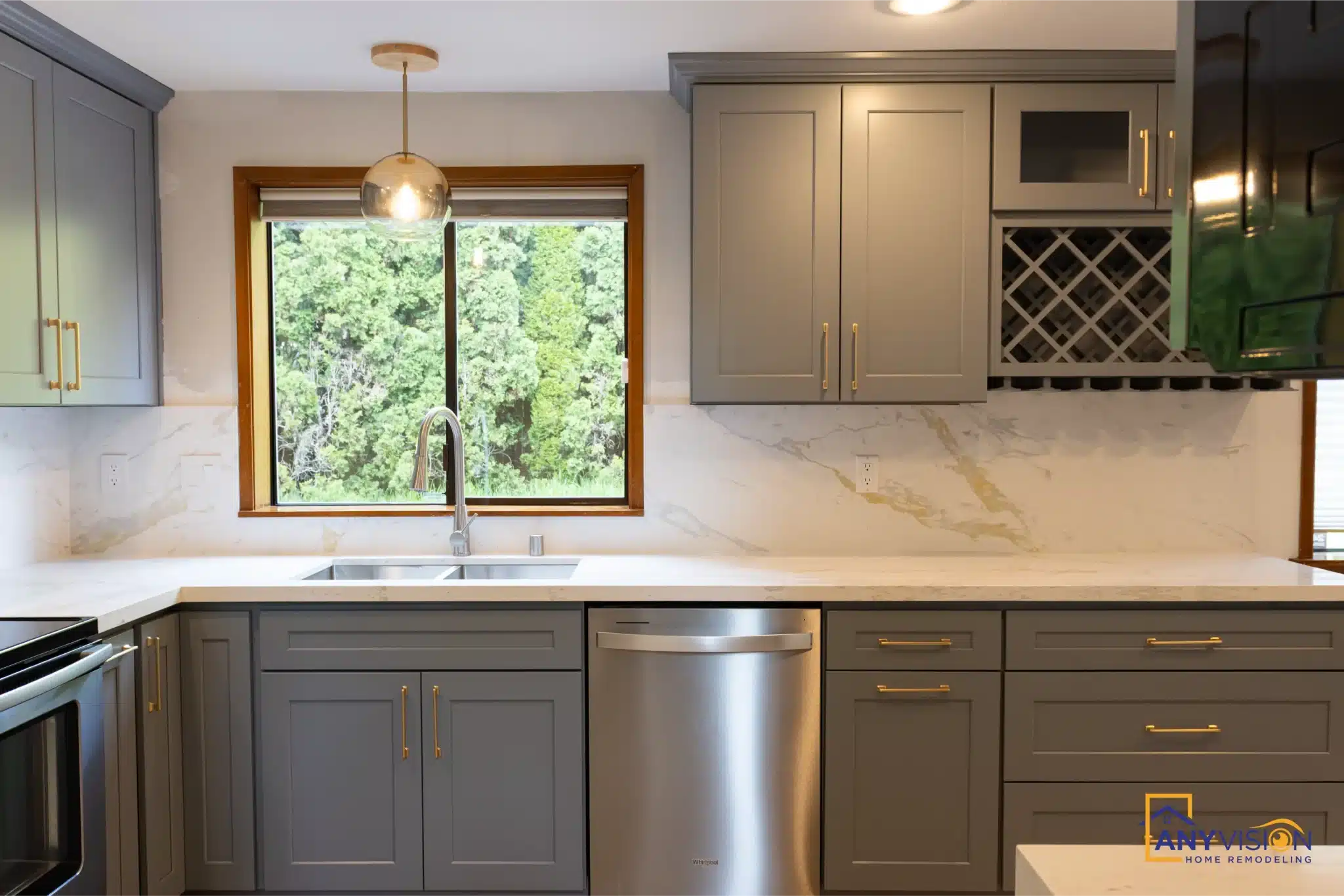 Corner sink beneath the window with the counter running either side