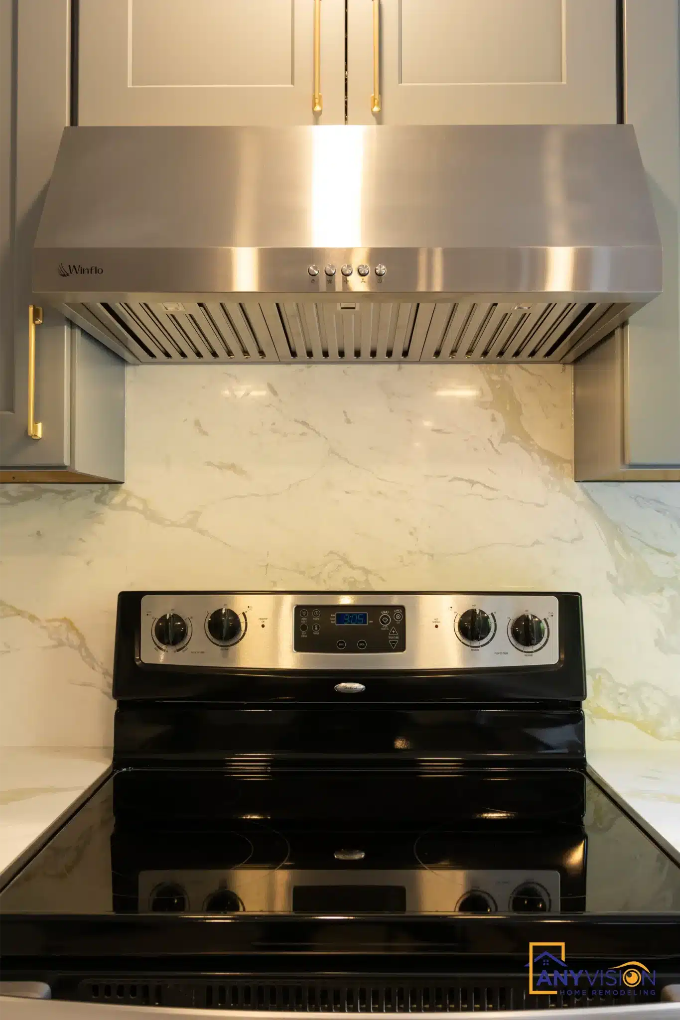 Stainless hood and slab detail above the range