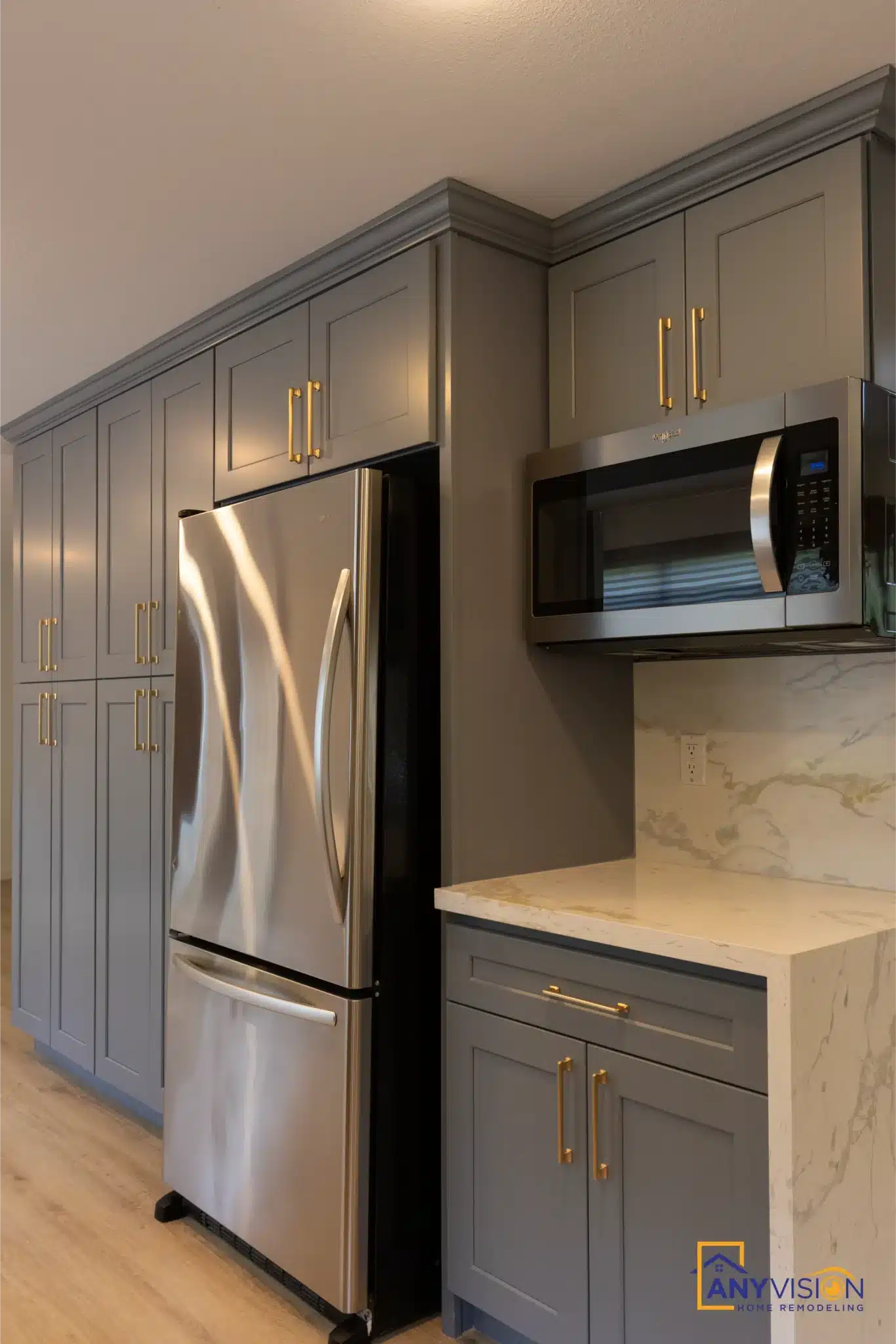 Refrigerator and microwave set into the tall cabinet run