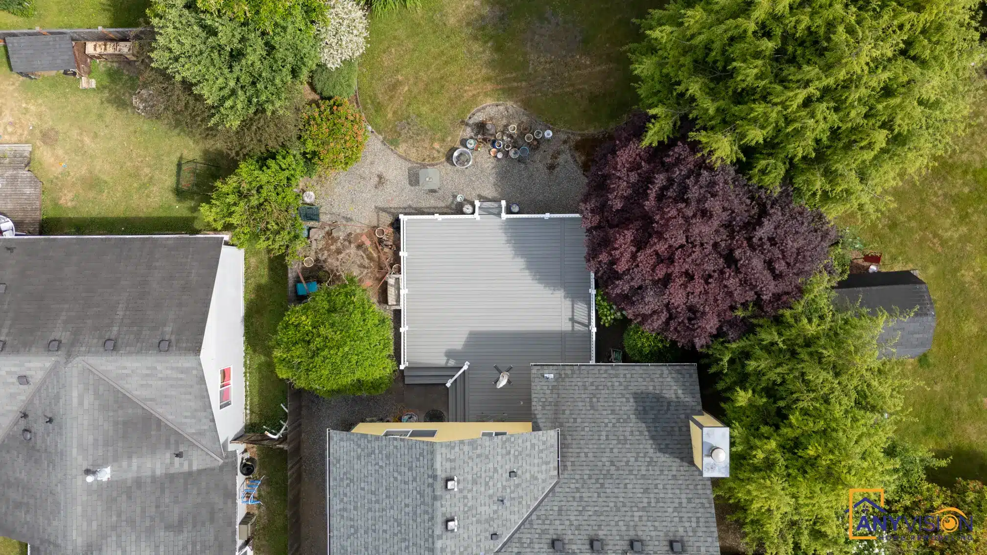 Overhead view of the property showing the deck within the established garden