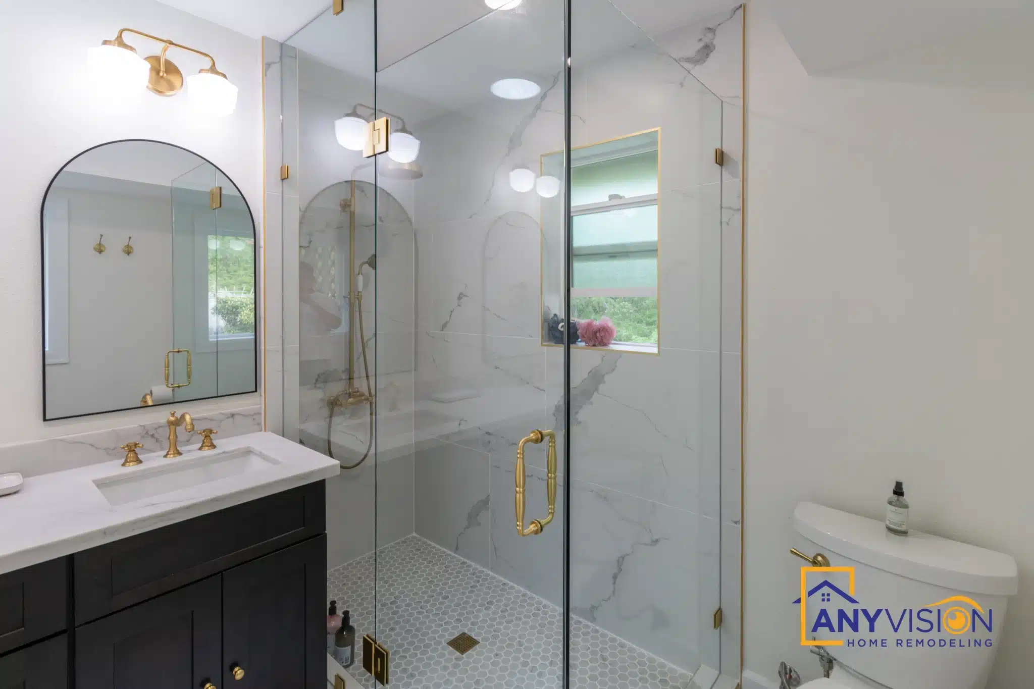 Bathroom looking toward the frameless glass shower with the window beyond