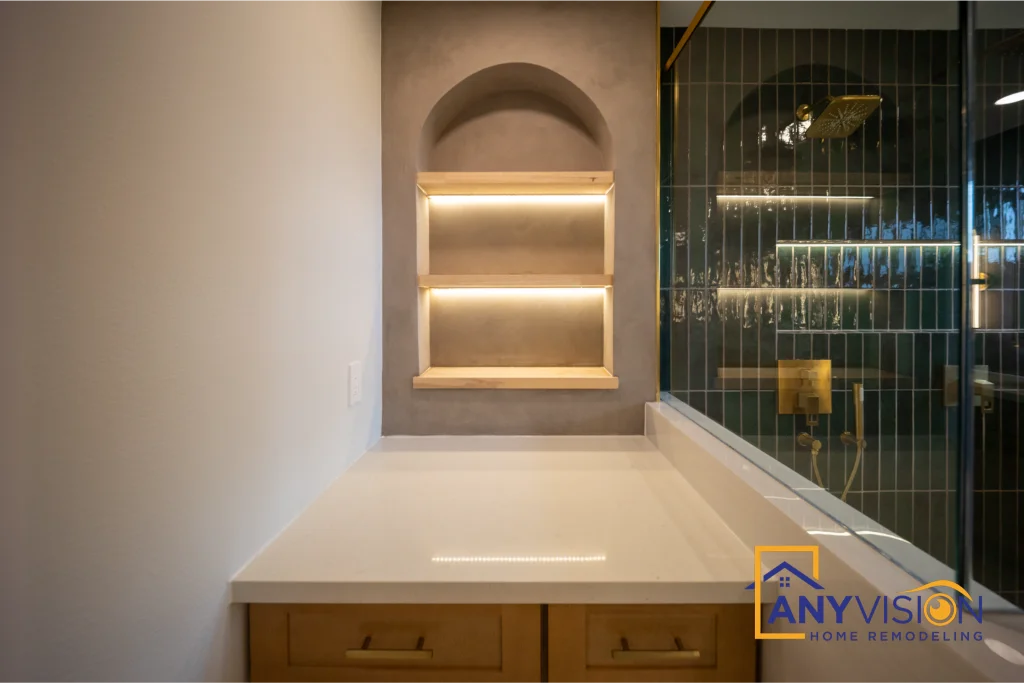 Arched niche above the bath lit from within by a concealed LED strip