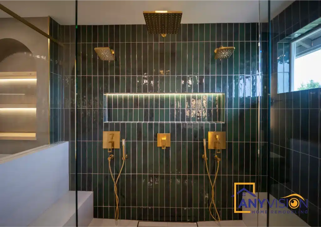 Dark green tiled wet zone with twin shower heads and brass fittings