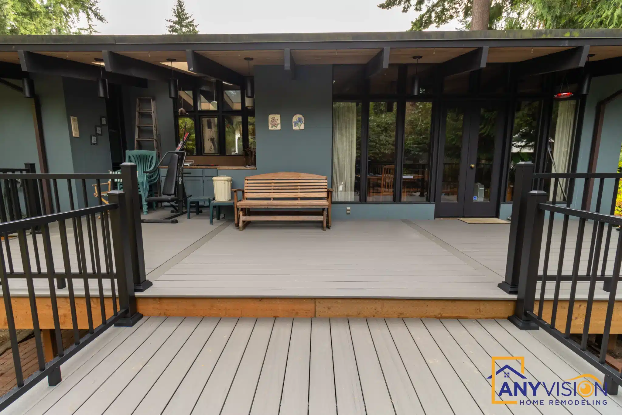 Covered deck with a finished ceiling opening directly off the interior through sliding doors