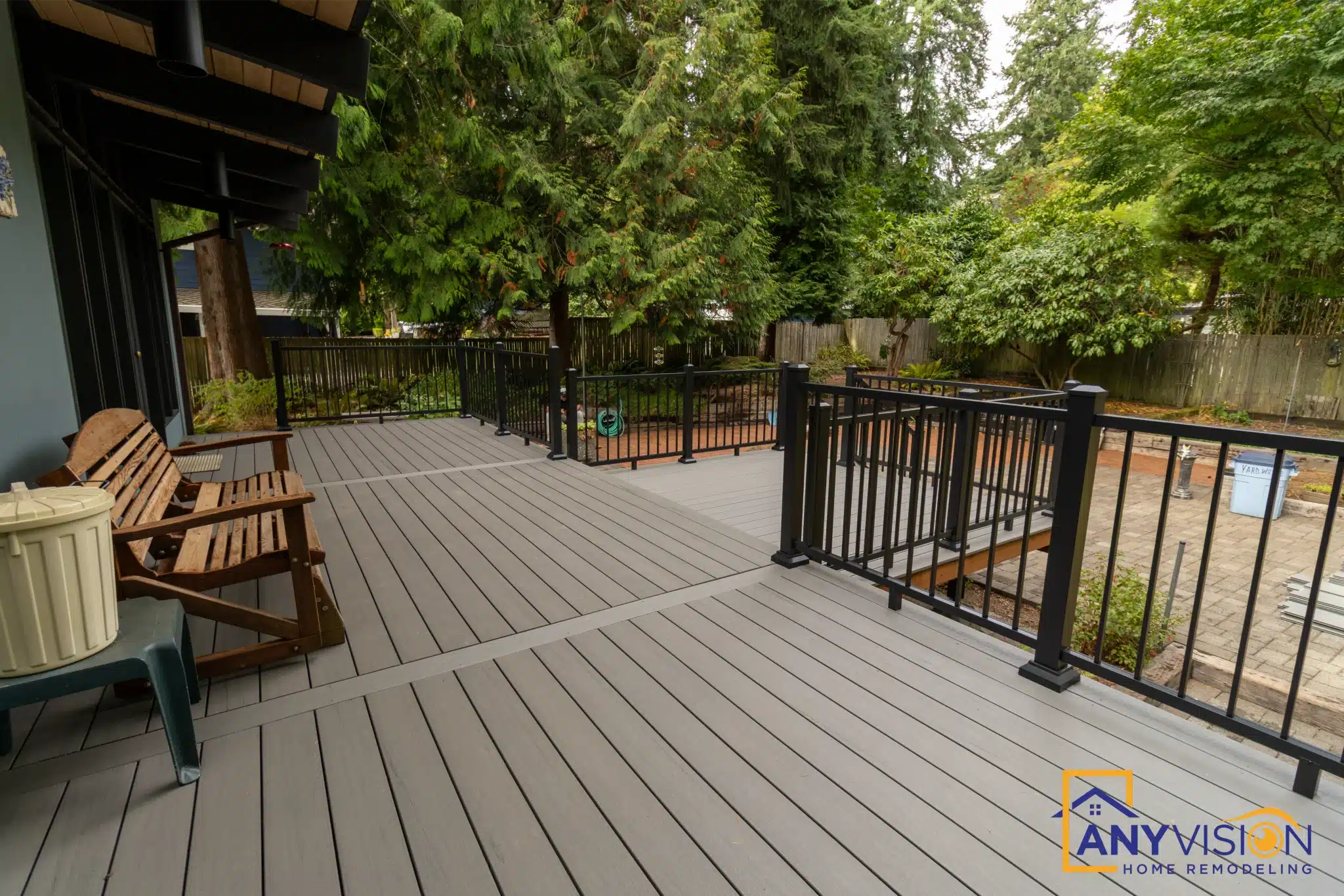 Deck seating beneath a finished ceiling with slim black railings