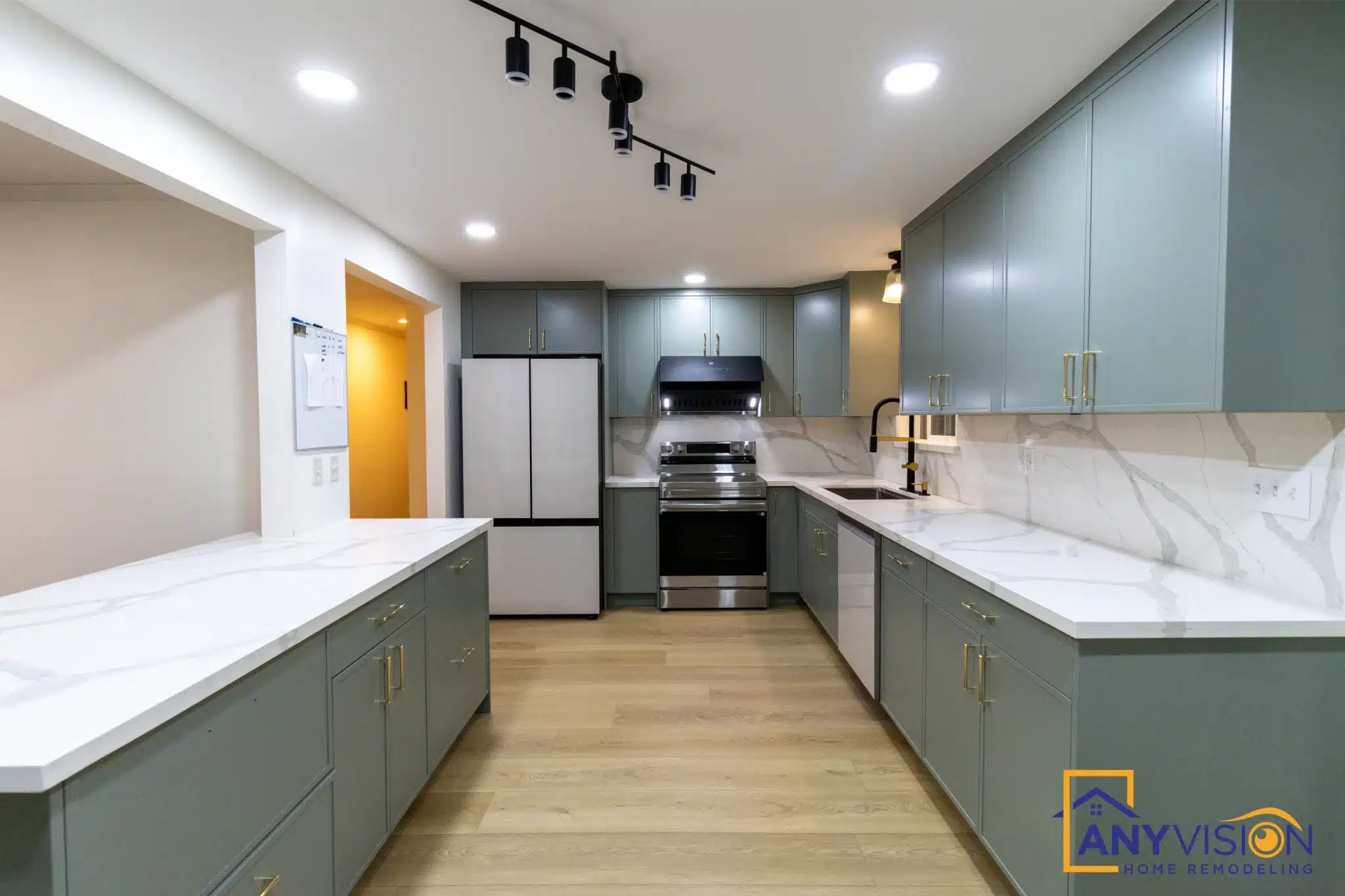 Full view of the kitchen showing the U-shaped run and waterfall peninsula