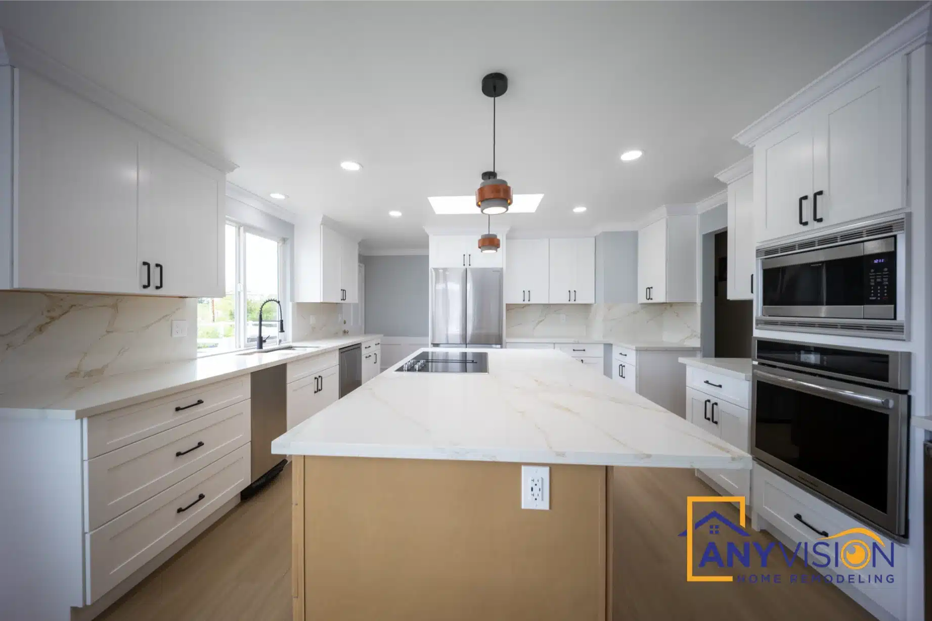 Island seen along its full length beneath copper pendant lights