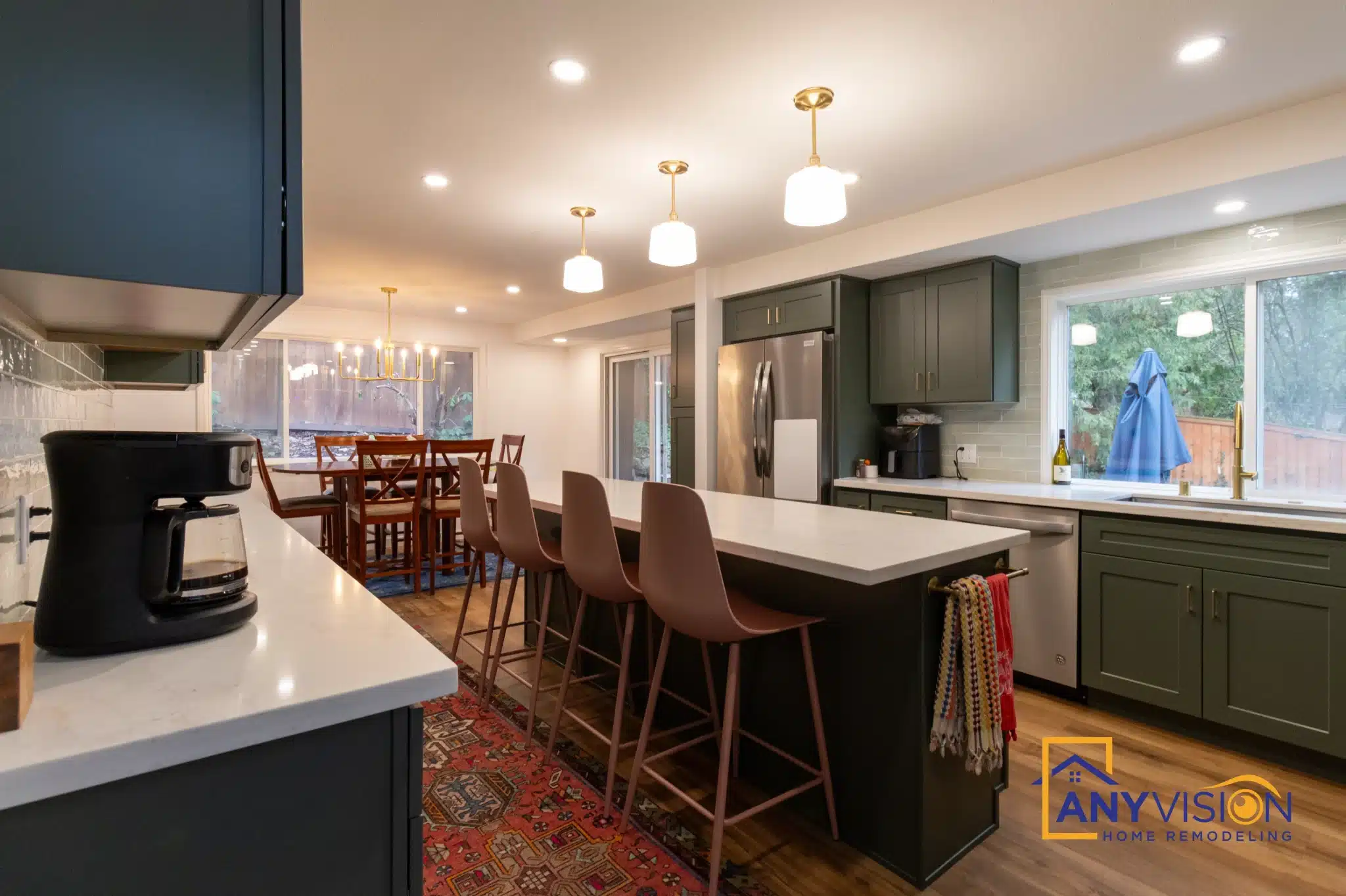 Island seating and pendant lighting in an open plan