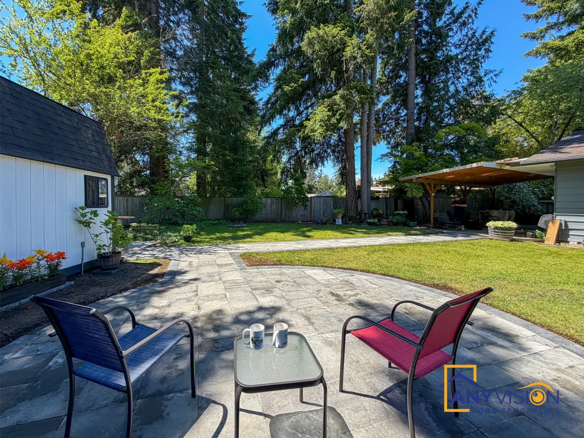 Circular paver patio with seating set into a lawn, Lake Hills Bellevue