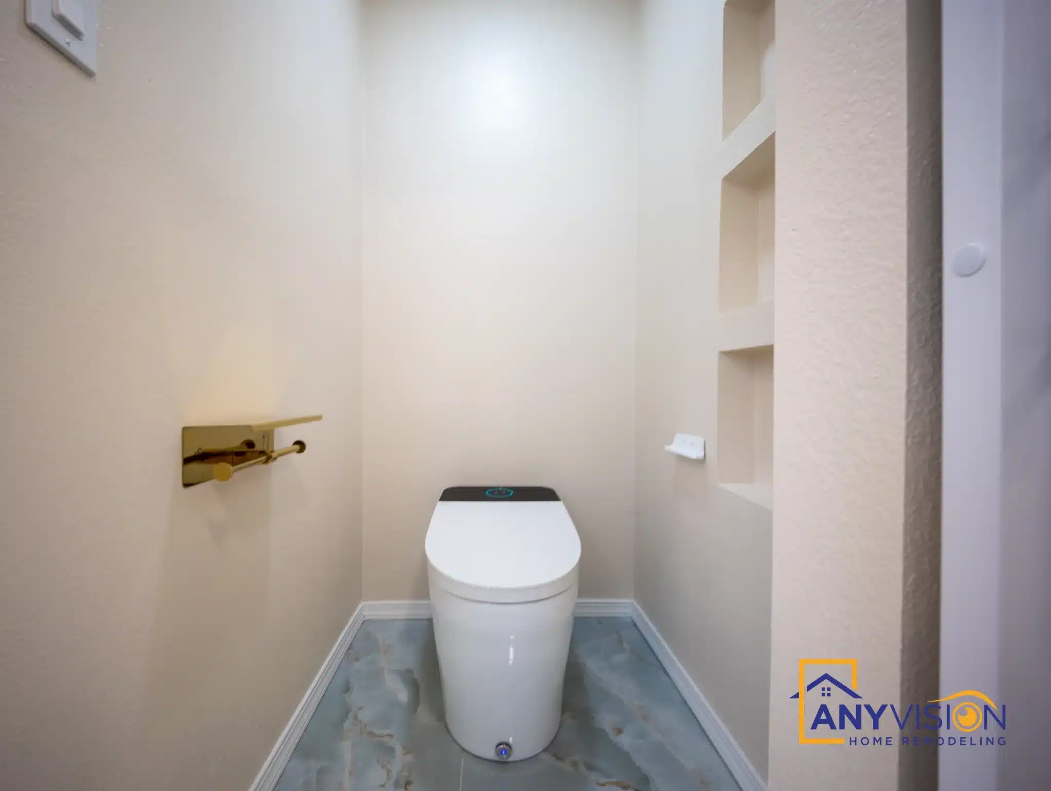 Recessed niches and gold fittings beside the WC alcove