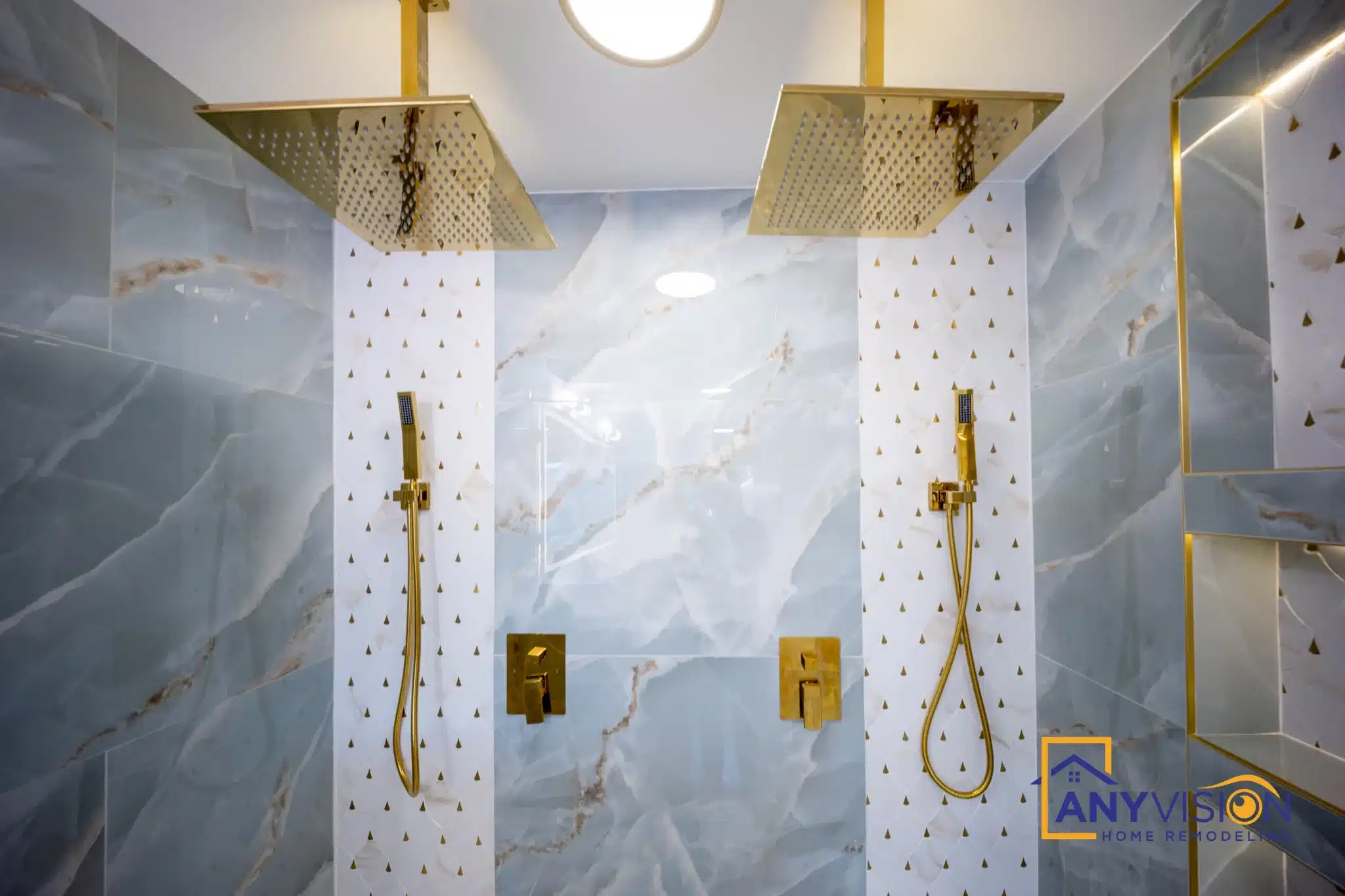 Gold rainfall head, handheld and thermostatic controls in the shower