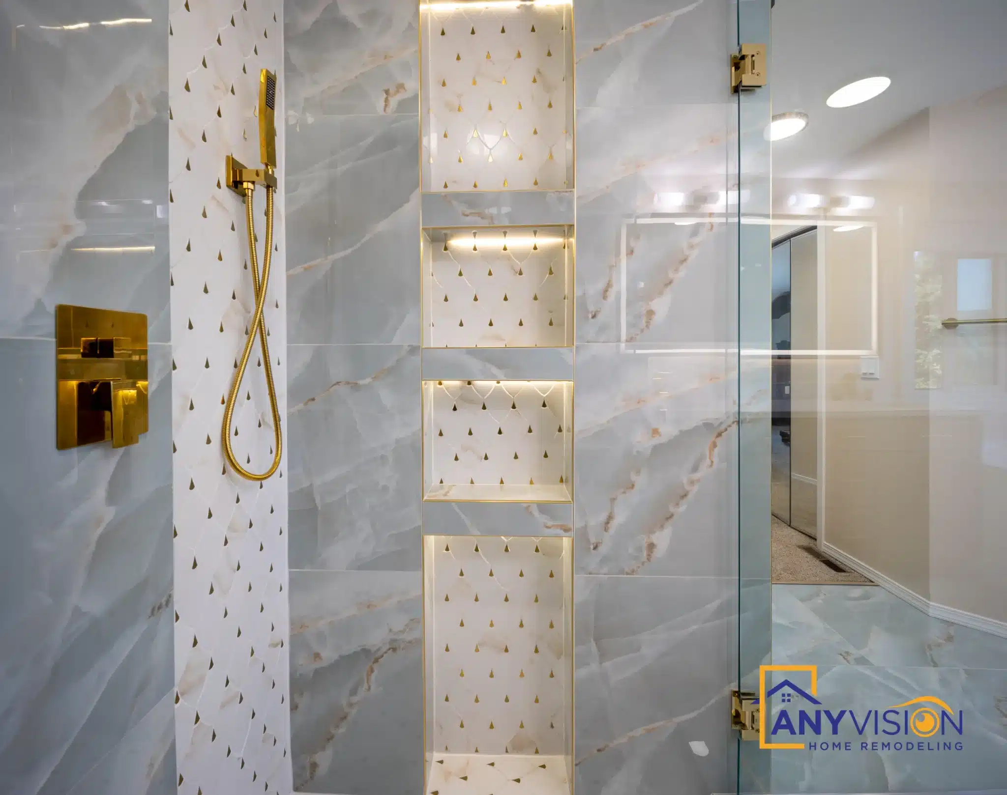 Walk-in shower with rainfall head, handheld and body sprays against marble-look slab