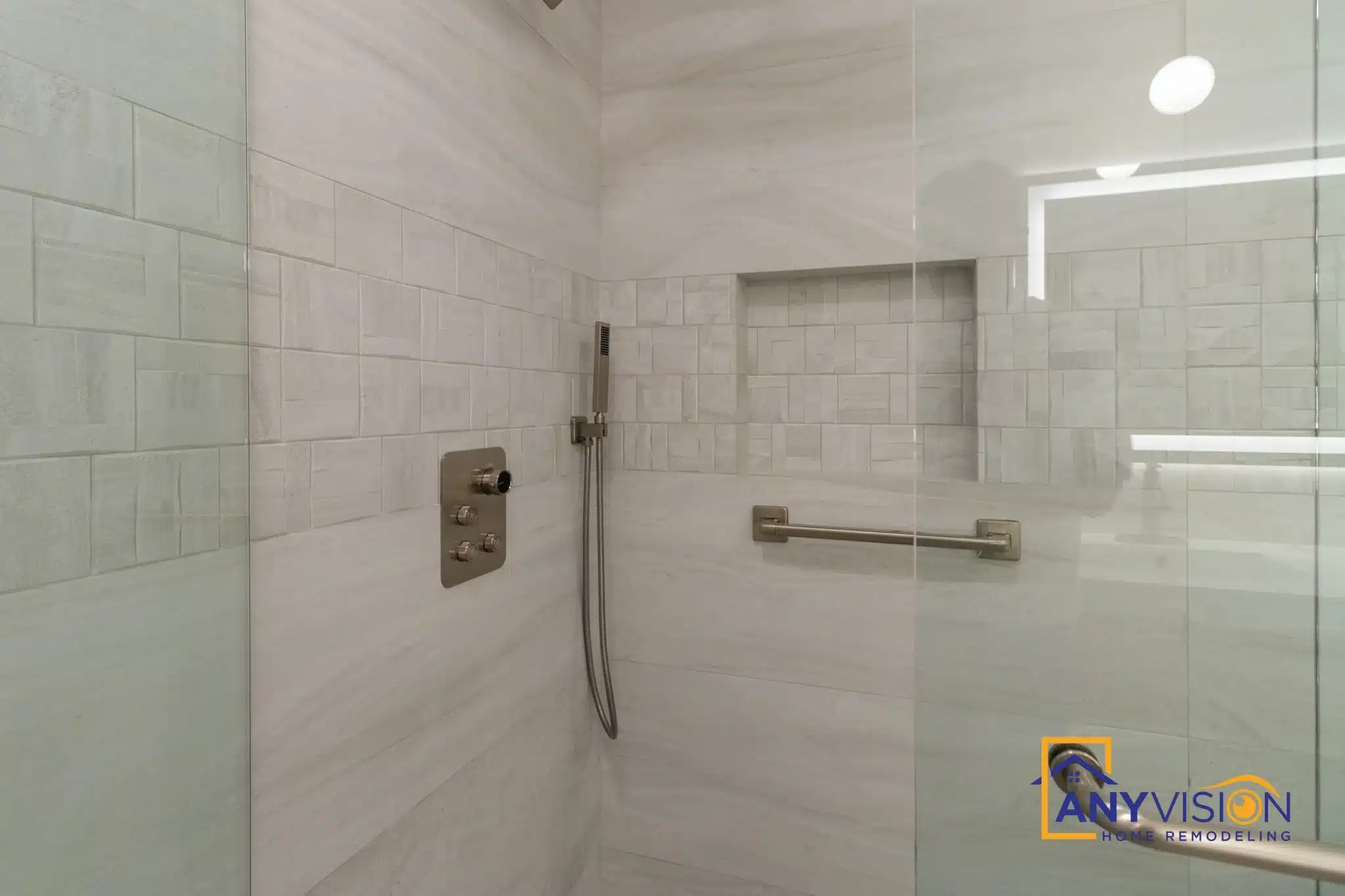 Shower interior with recessed niche and large-format tile