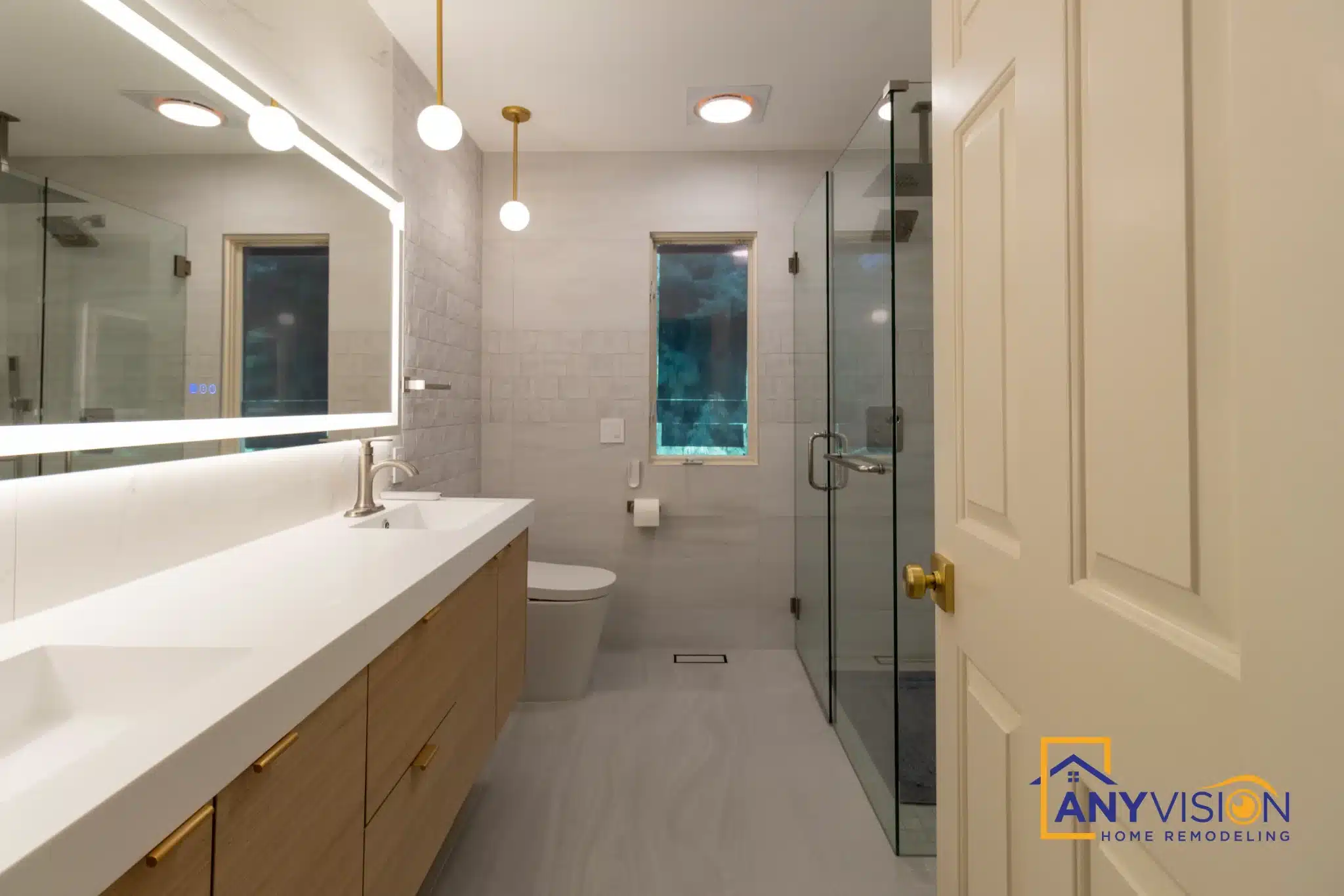 View from the doorway through to the vanity, shower and window beyond