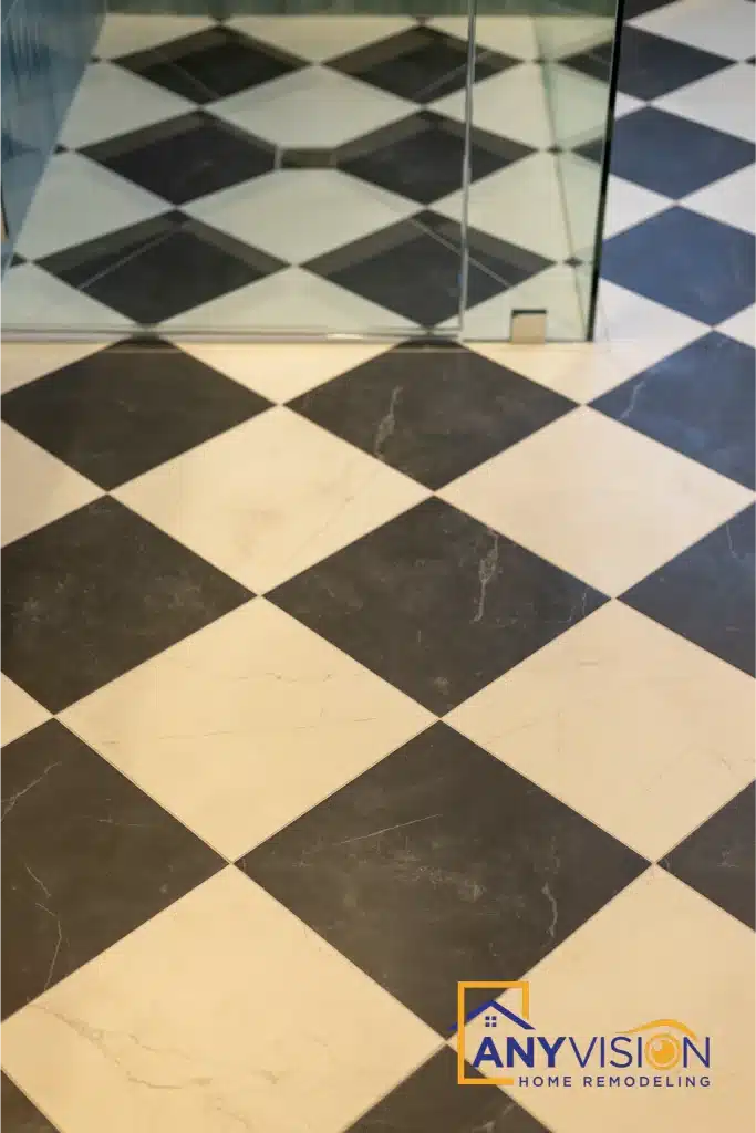Black and white checkerboard marble floor laid on the diagonal